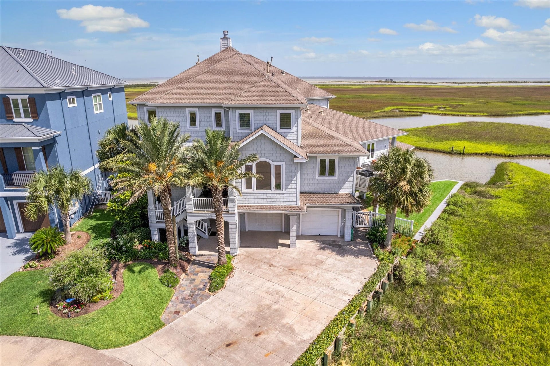 1 Shell Key, Hitchcock, TX 77563 The manicured grounds and lush landscaping accented by landscape lighting enhance its curb appeal, making this a rare and exceptional offering on the Texas Gulf Coast