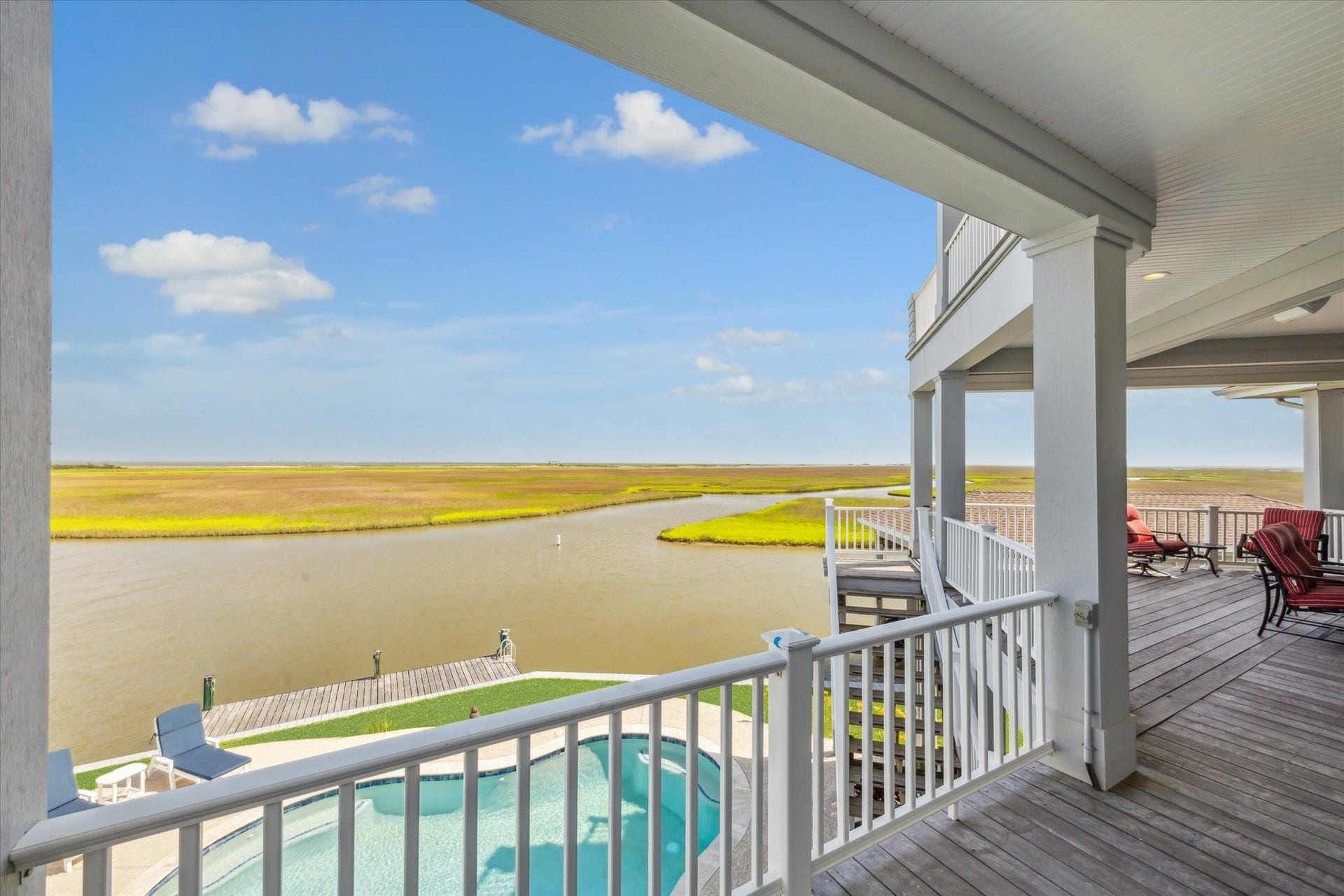 1 Shell Key, Hitchcock, TX 77563 Overlooking the scenic beauty of West Galveston Bay, it offers a seamless extension of the indoor living space, inviting you to enjoy breathtaking sunsets, warm Gulf breezes, and the laid-back luxury of life on the water. Whether hosting gatherings or unwinding with a from the day, this patio embodies the relaxed, waterfront lifestyle that defines West Galveston Bay living