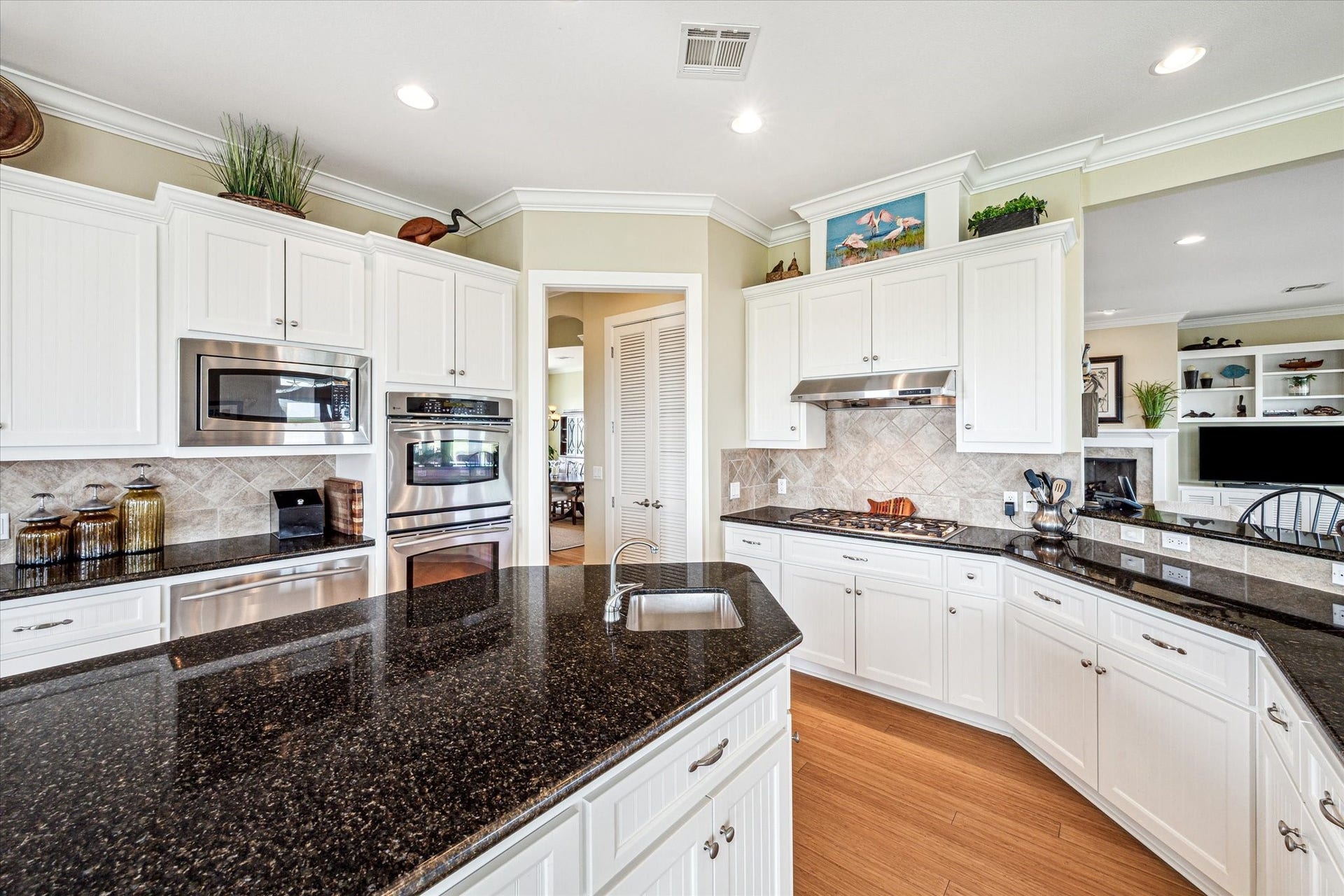 1 Shell Key, Hitchcock, TX 77563 At the center, a large island with a built-in prep sink provides the perfect workspace for cooking and entertaining