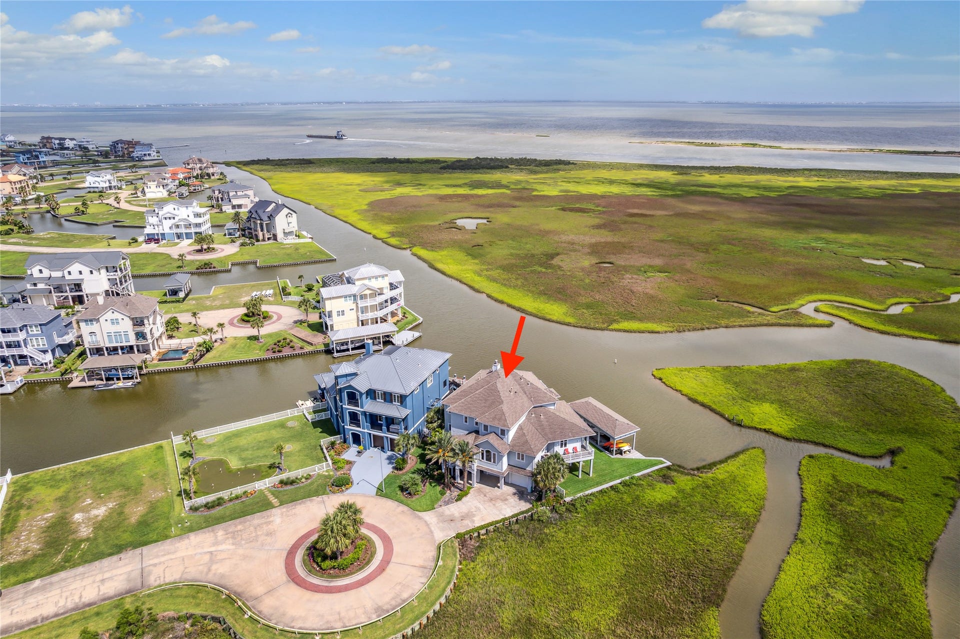 1 Shell Key, Hitchcock, TX 77563 This stunning waterfront home is perfectly positioned at the tip of a cul-de-sac on a premier homesite offering unparalleled privacy and panoramic views. Situated along a wide canal with immediate access to West Galveston Bay, the home captures expansive vistas of the coastal wetlands and open water beyond. The unique placement provides unobstructed sightlines in multiple directions, showcasing the beauty of the surrounding nature preserve and vibrant sunsets