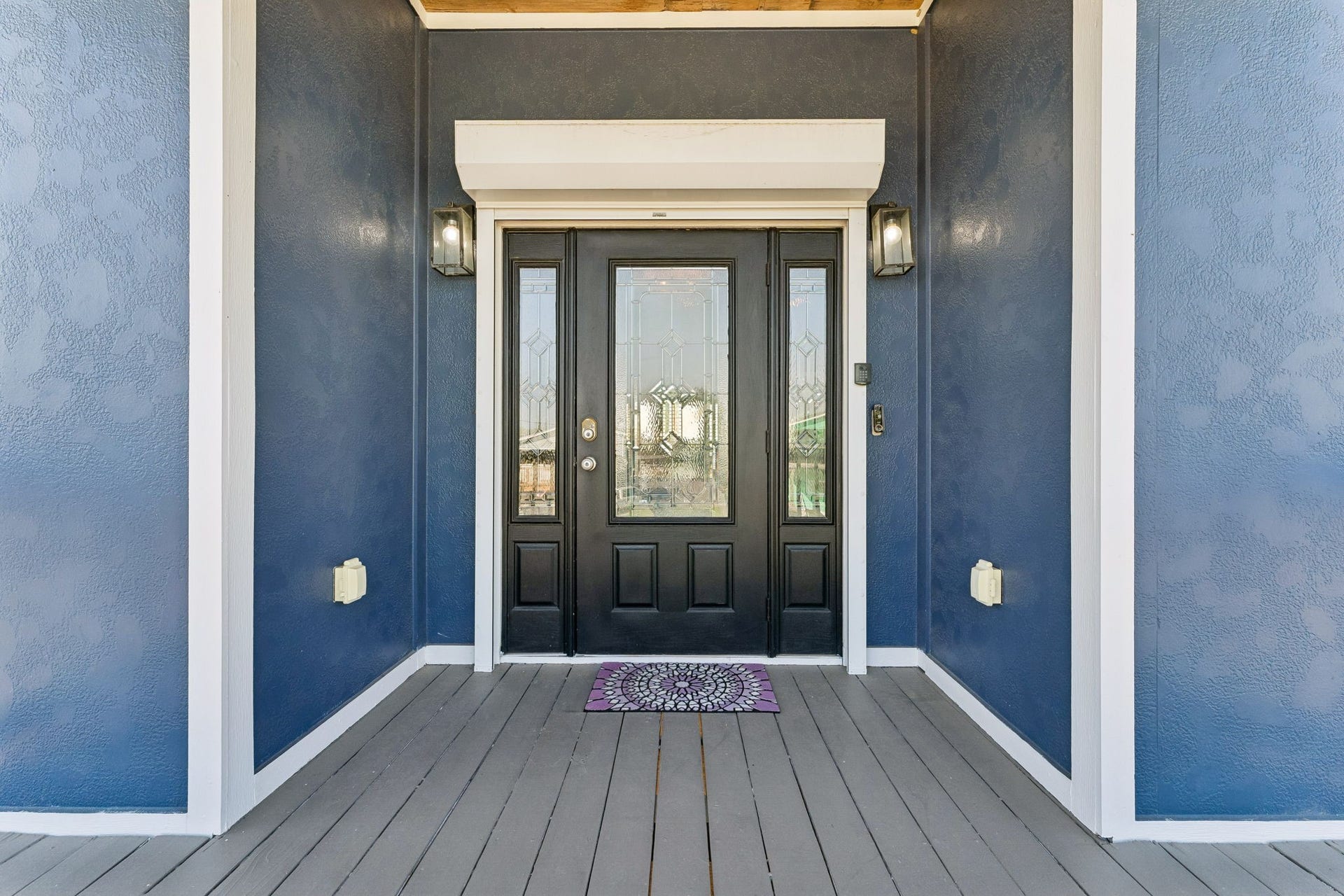 1623 Dick Bay Drive, San Leon, TX 77539 Covered front porch welcomes you with a striking double entry door framed by decorative glass sidelights. A polished first impression sets the tone for the home within.