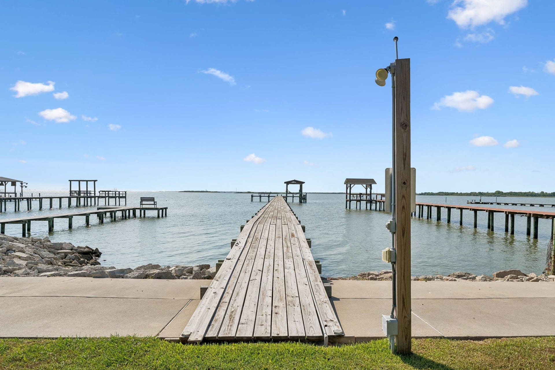 1623 Dick Bay Drive, San Leon, TX 77539 Private pier stretches directly into Galveston Bay, offering effortless access to open water. Sweeping bay views create an incredible setting for fishing, boating, and waterfront living.