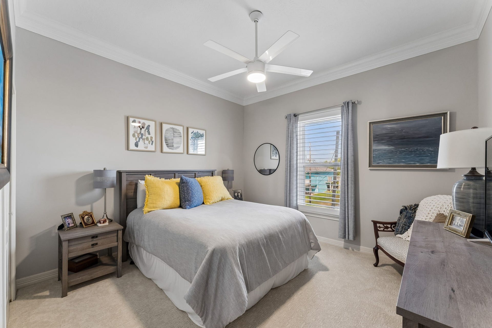1623 Dick Bay Drive, San Leon, TX 77539 Comfortable bedroom offers a calm, inviting atmosphere with soft natural light and neutral finishes. A ceiling fan and generous proportions create an easy, relaxing space.