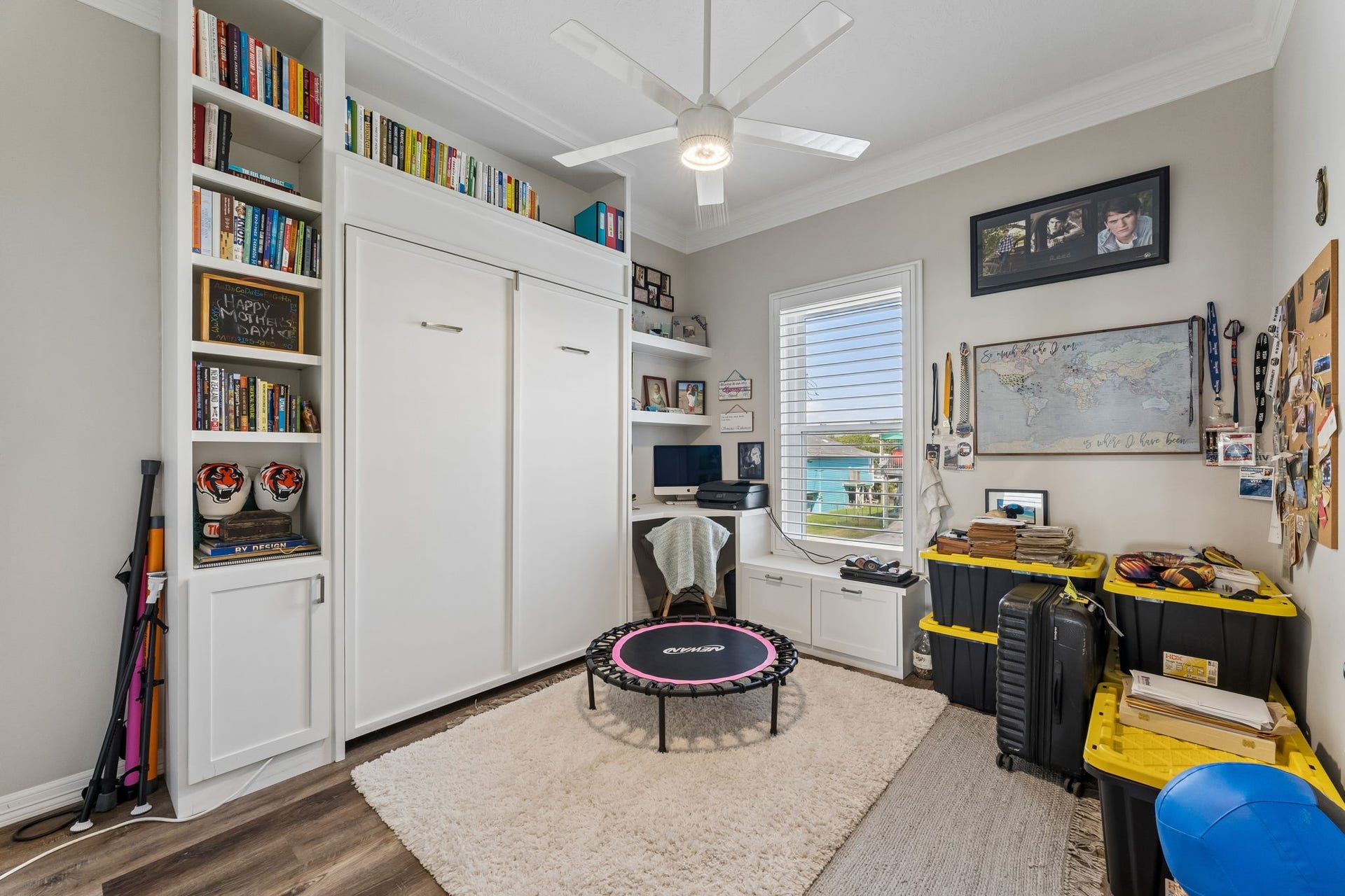 1623 Dick Bay Drive, San Leon, TX 77539 Flexible bedroom features custom built ins, integrated shelving, and a convenient workspace. Thoughtful storage maximizes functionality while keeping the room open and organized.