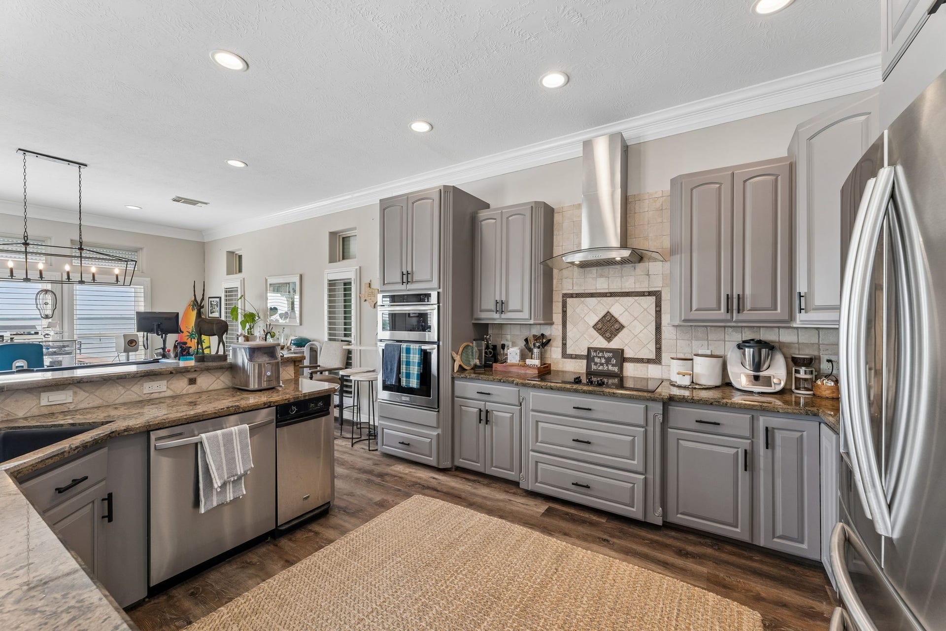 1623 Dick Bay Drive, San Leon, TX 77539 Well equipped kitchen features extensive custom cabinetry, stainless steel appliances, and generous prep space. The open design keeps the kitchen connected to the surrounding entertainment areas.