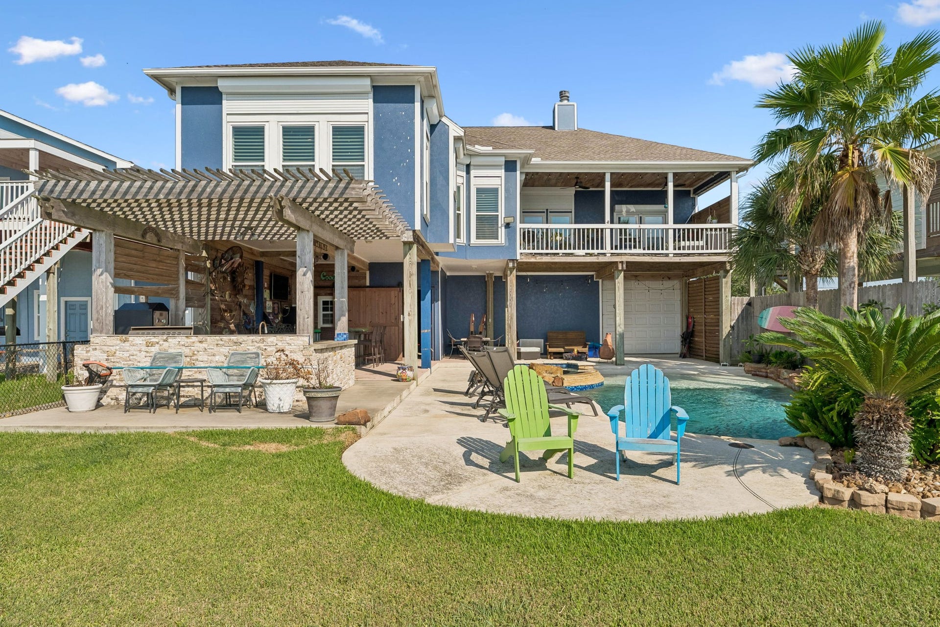 1623 Dick Bay Drive, San Leon, TX 77539 Expansive backyard brings together a sparkling pool, covered entertaining areas, and a lush lawn for the ultimate outdoor lifestyle. Multiple seating areas offer plenty of space to relax and enjoy the coastal setting.