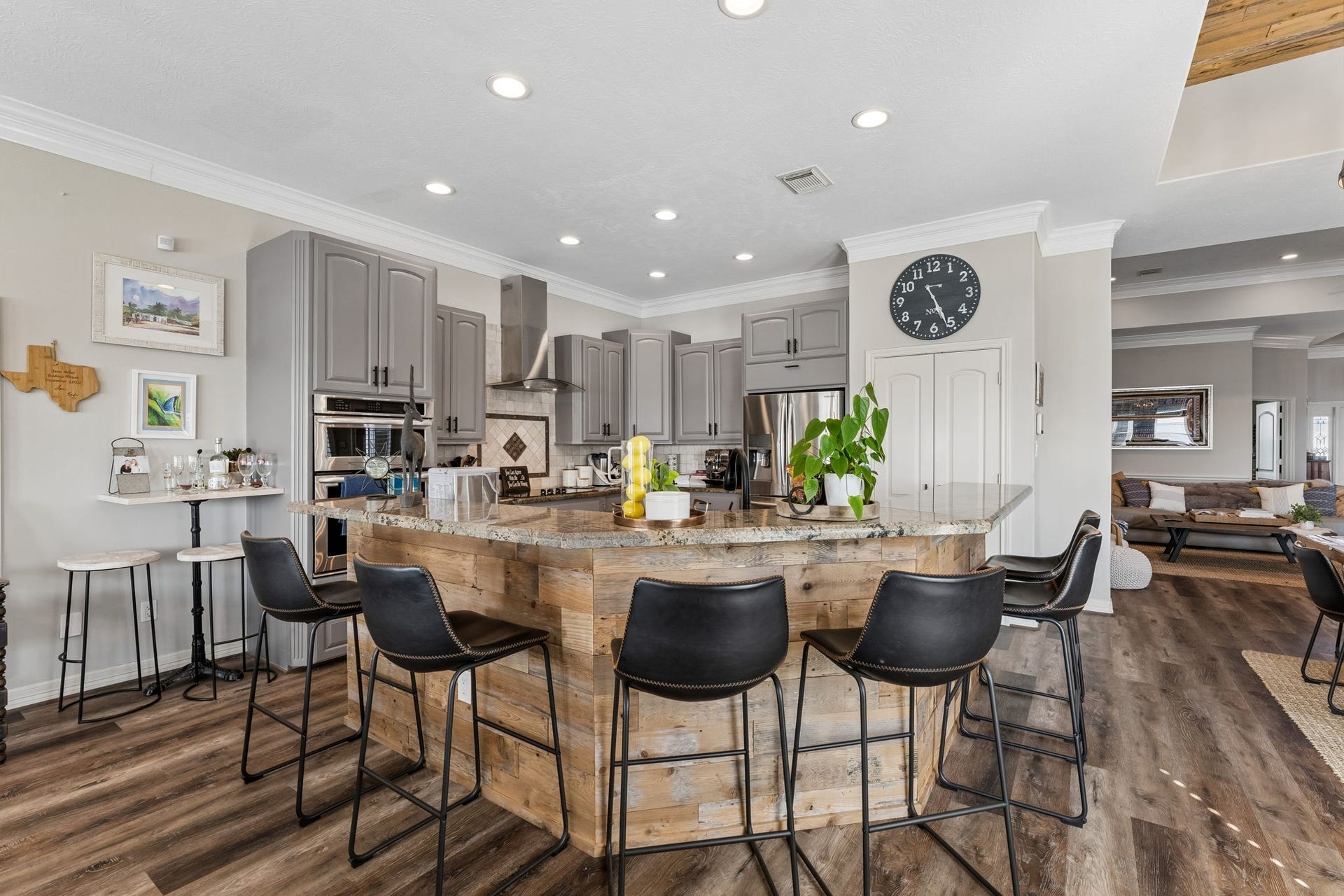 1623 Dick Bay Drive, San Leon, TX 77539 Spacious kitchen island provides generous seating and creates a natural gathering place at the heart of the home. Granite countertops and abundant cabinetry offer plenty of room for cooking, serving, and entertaining.
