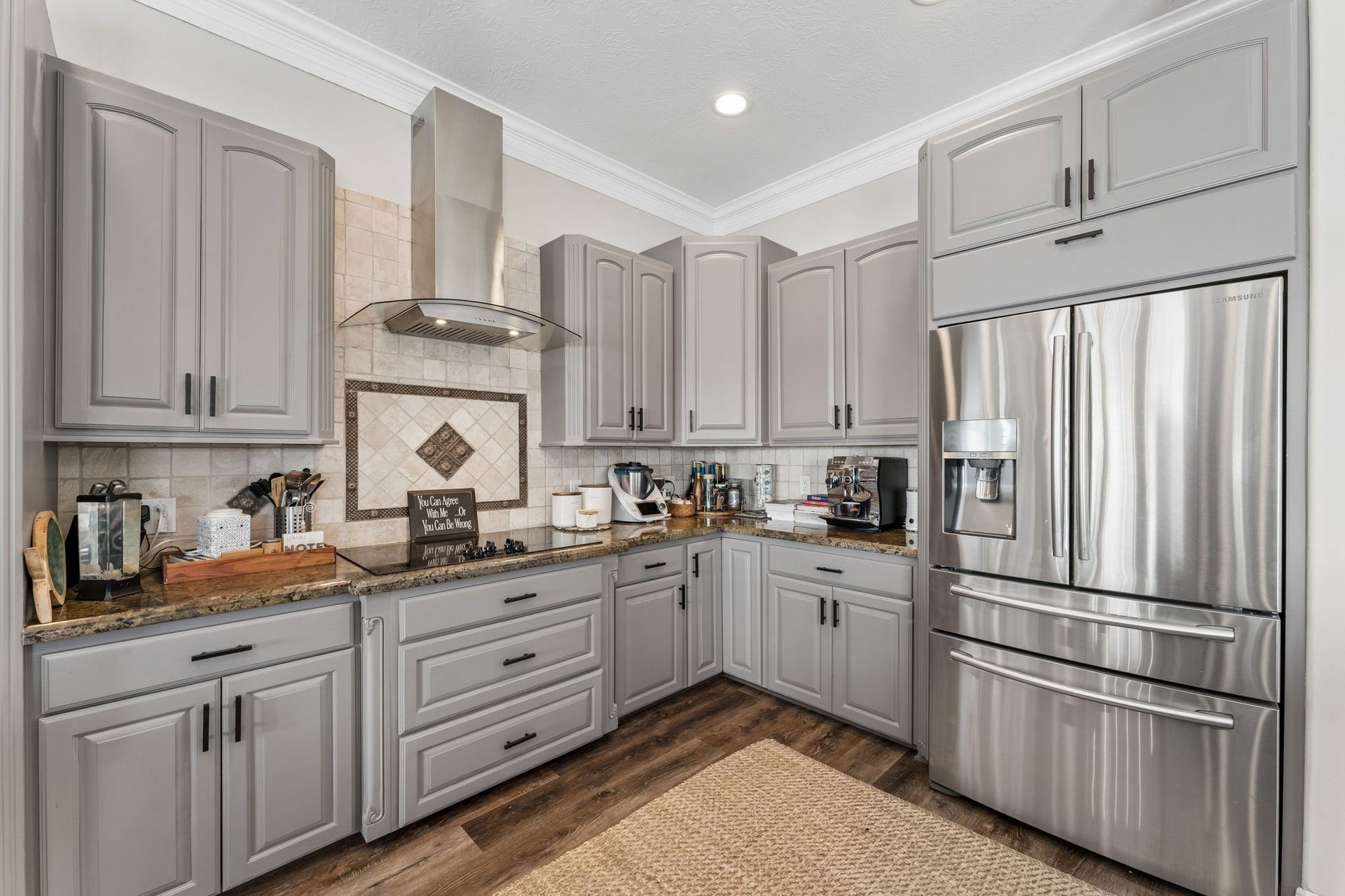 1623 Dick Bay Drive, San Leon, TX 77539 Beautifully appointed kitchen featuring custom cabinetry, granite countertops, and stainless steel appliances. Thoughtful storage and elegant finishes combine style with everyday functionality.