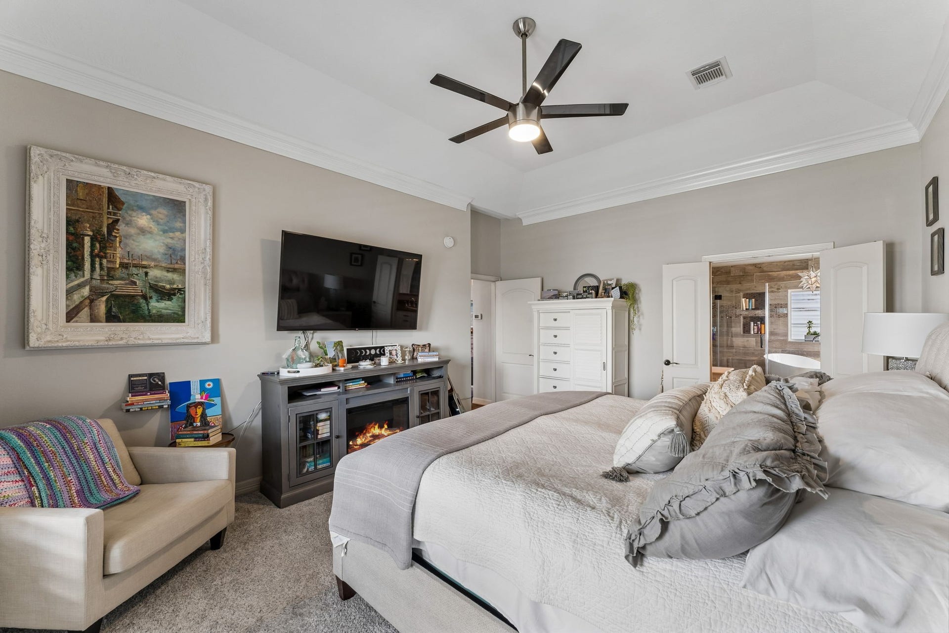 1623 Dick Bay Drive, San Leon, TX 77539 Another view of the primary suite highlights its generous proportions and comfortable sitting area. A wide doorway provides direct access to the beautifully appointed primary ensuite.