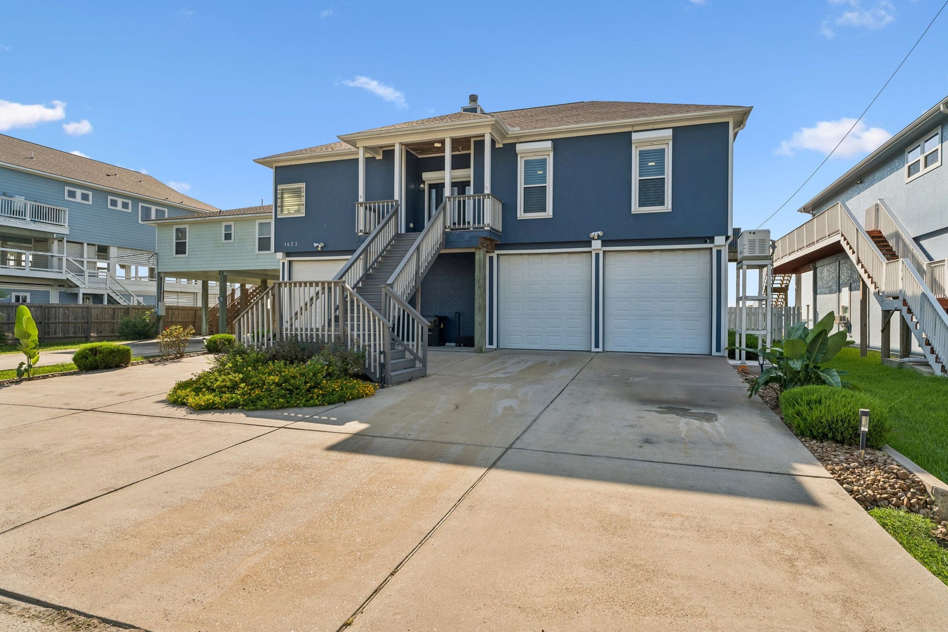 1623 Dick Bay Drive, San Leon, TX 77539 Classic coastal curb appeal with a stately elevated design and inviting covered entry. An expansive driveway provides plenty of space for parking and easy everyday access.