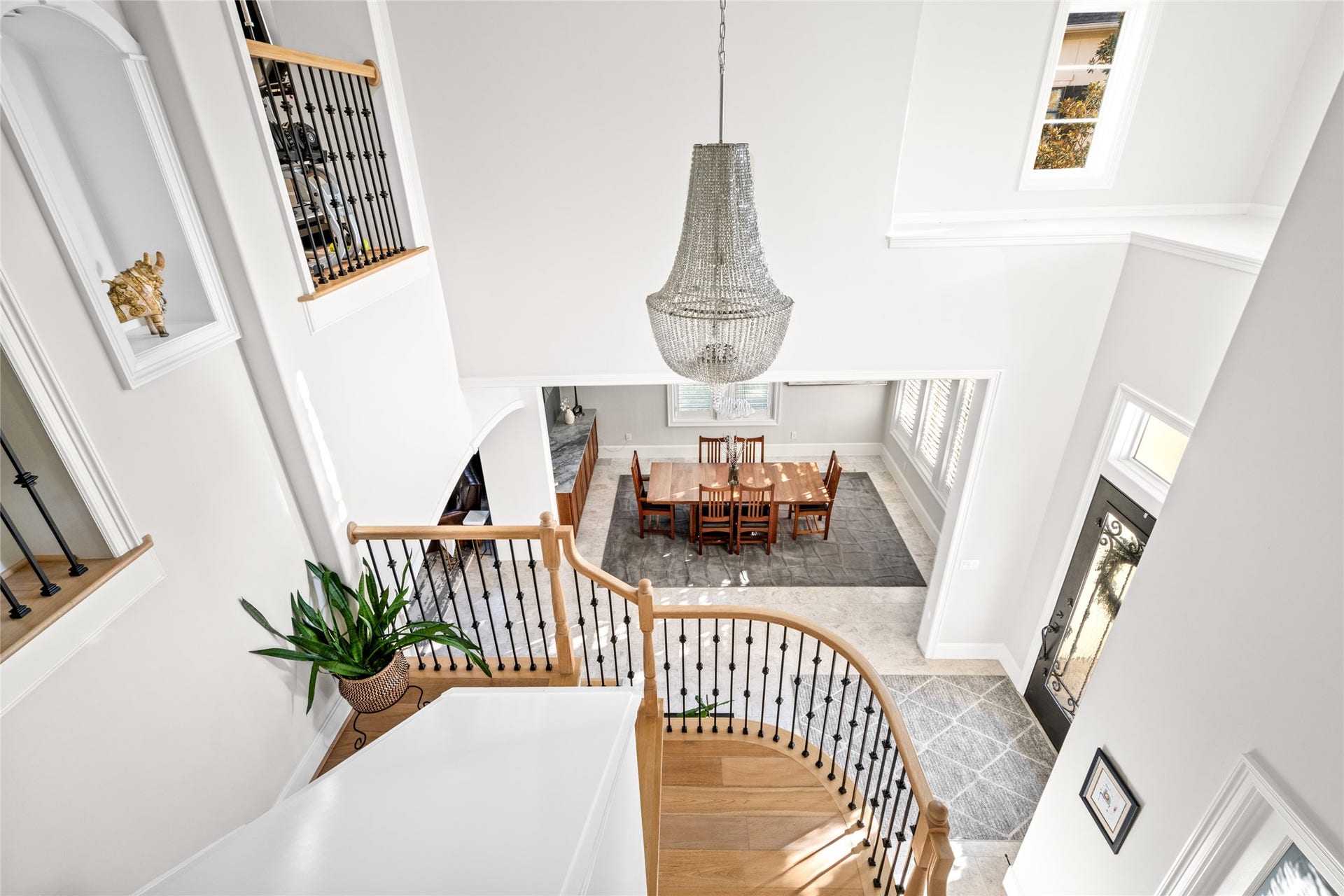 Second floor overlooking the grand foyer with better view of the entry chandelier