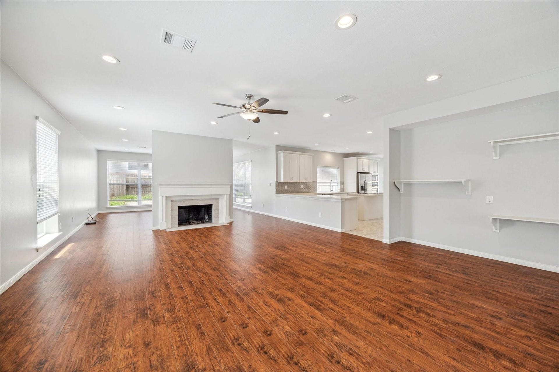 6003 Ancient Oaks Drive, Humble, TX 77346 Wide view of the open-concept living area, showcasing its generous size, bright interior, and seamless connection to the kitchen.