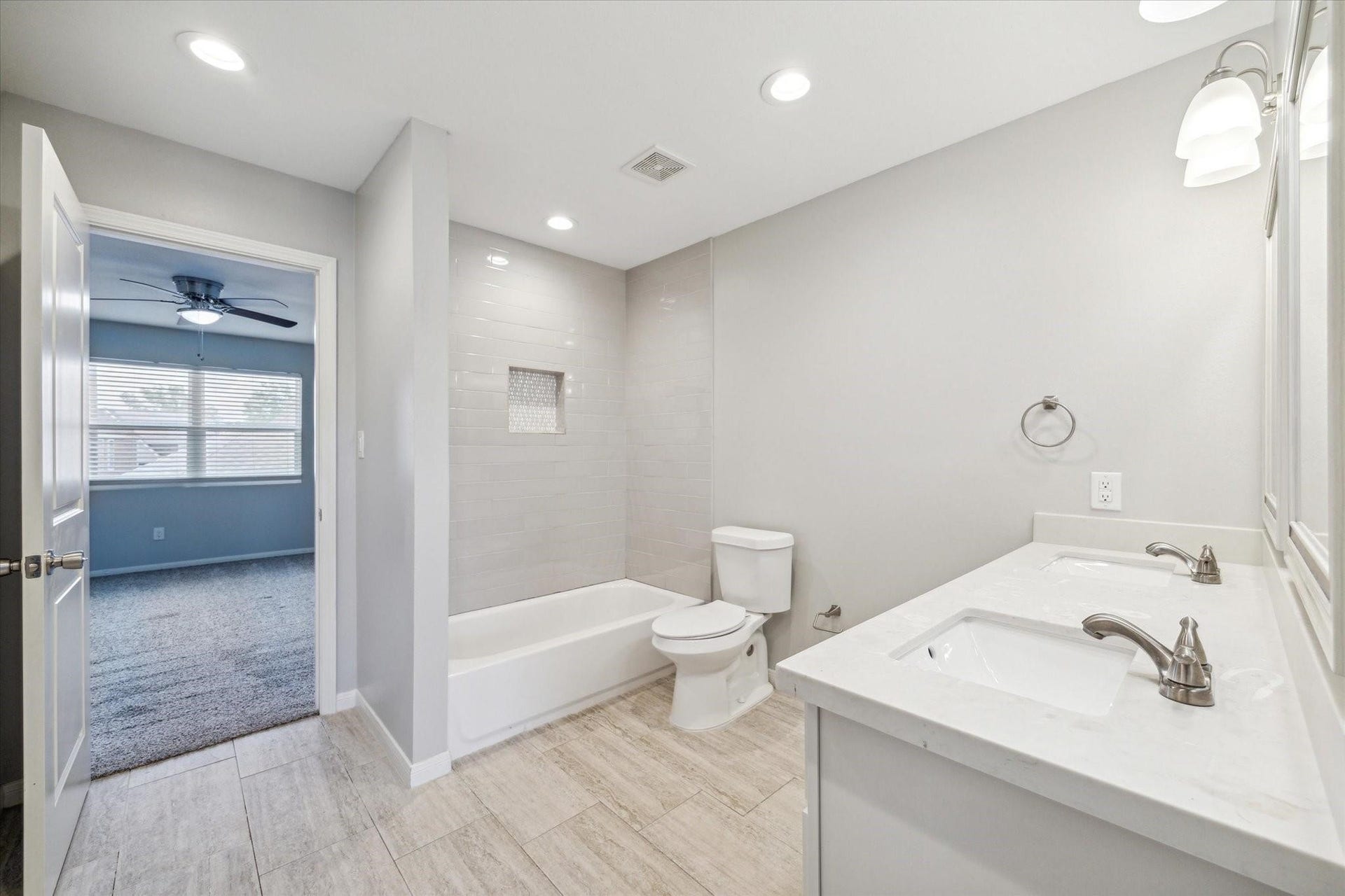 6003 Ancient Oaks Drive, Humble, TX 77346 Alternate view of the secondary bathroom featuring a large vanity, recessed lighting, neutral finishes, and a shower-and-tub combination.
