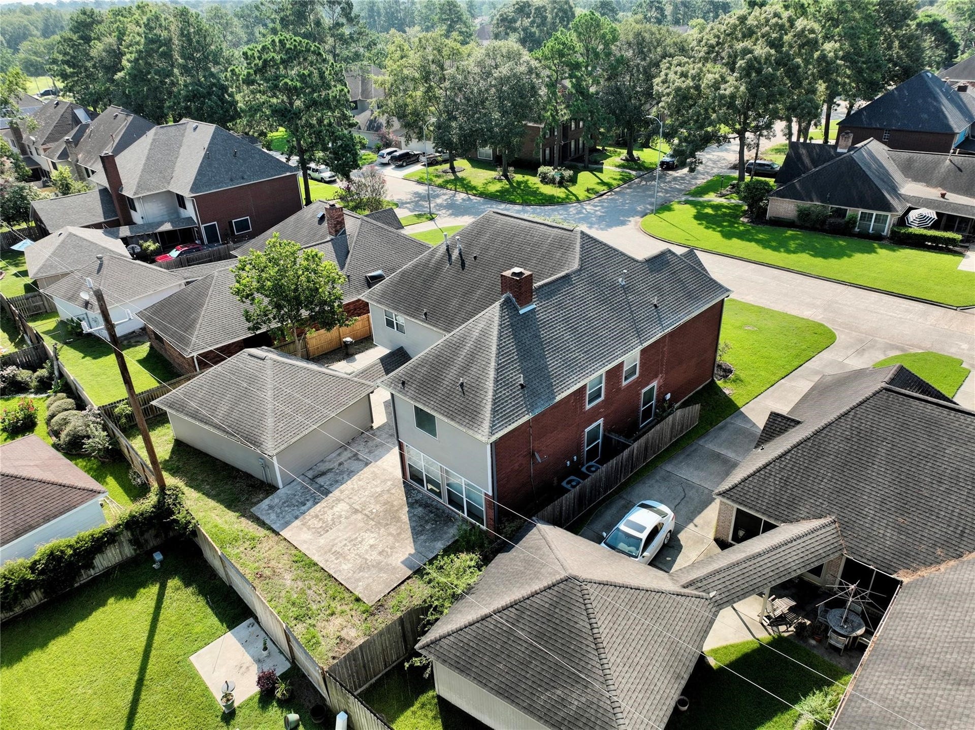 6003 Ancient Oaks Drive, Humble, TX 77346 Aerial view highlighting the homes roofline, surrounding properties, tree-lined streets, and convenient neighborhood layout.