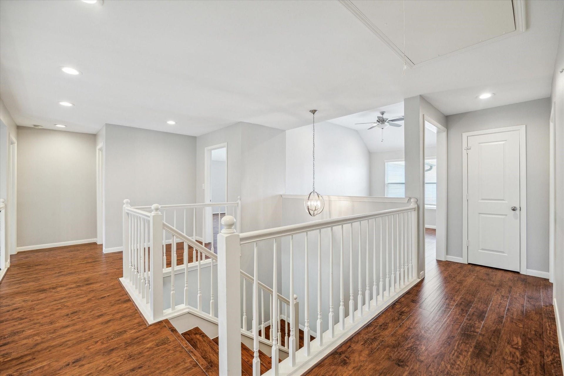 6003 Ancient Oaks Drive, Humble, TX 77346 Spacious upstairs landing with wood-look flooring, a stairway overlook, recessed lighting, and convenient access to the bedrooms and game room.