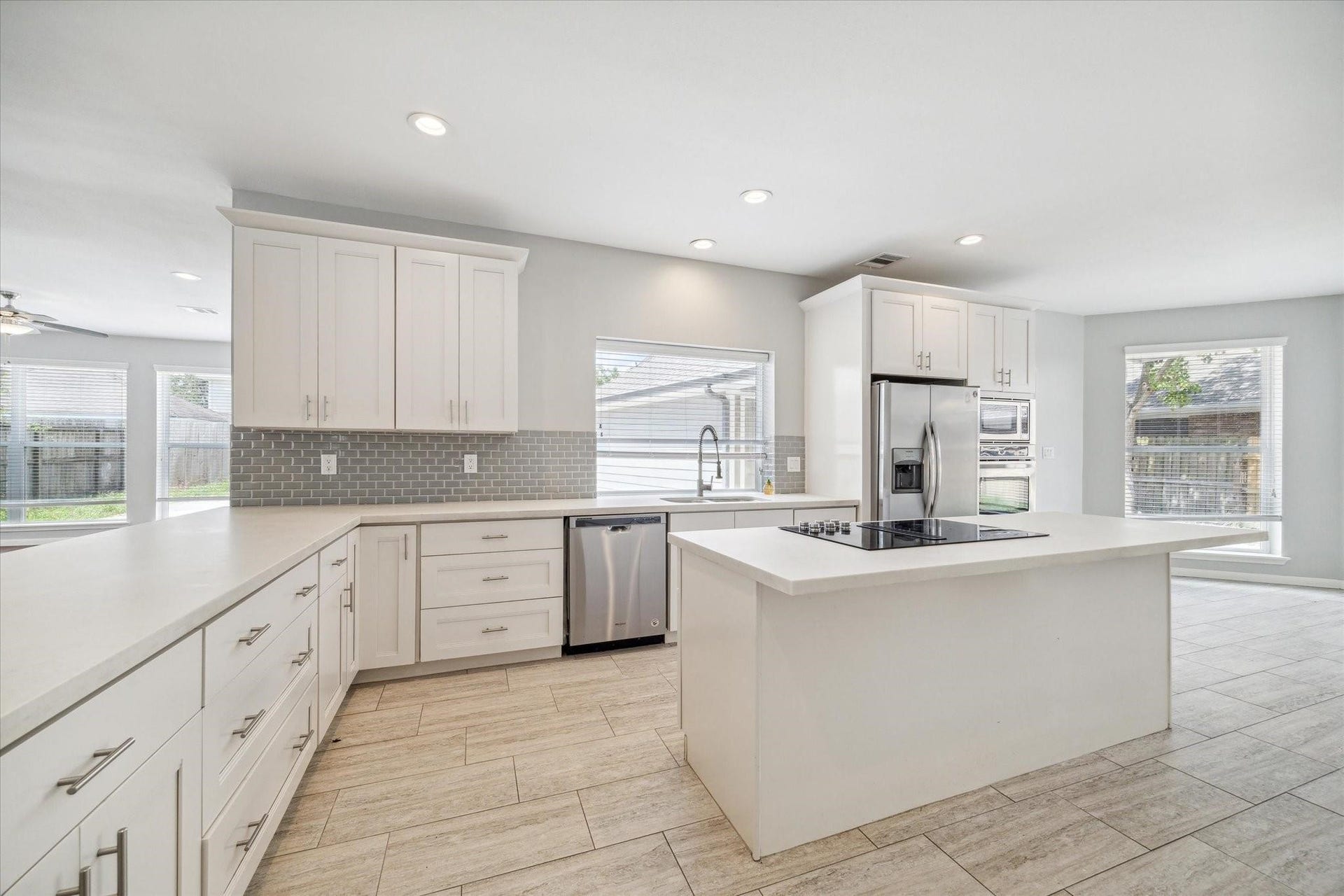 6003 Ancient Oaks Drive, Humble, TX 77346 Remodeled kitchen featuring abundant cabinetry, generous counter space, stainless steel appliances, recessed lighting, and an oversized center island.