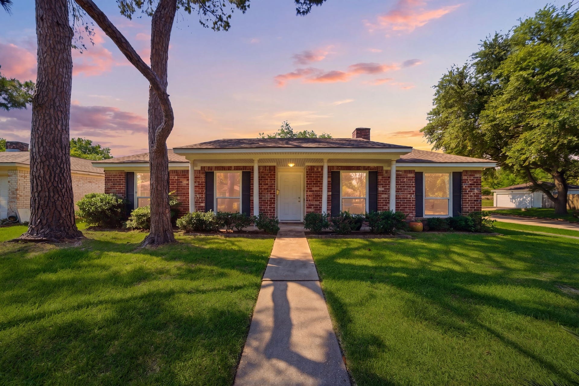 9231 Tooley Drive, Houston, TX 77031 Welcome to 9231 Tooley Drive, a traditional brick residence showcasing classic curb appeal with a symmetrical facade and well-manicured lawn. Towering shade trees frame the entryway, while a straight concrete walkway leads to a covered front porch supported by crisp white columns. Highlighting timeless Houston style, the exterior features dark shutters and a composition roof, creating a polished look in a quiet neighborhood setting.