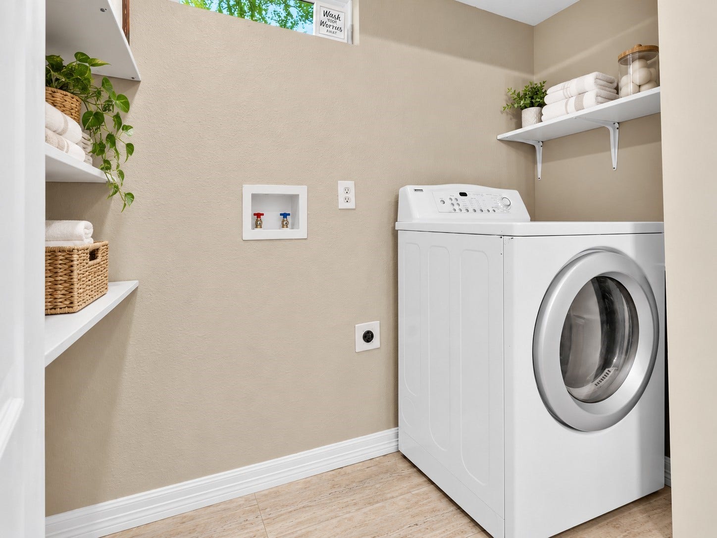 604 19th Avenue N, Texas City, TX 77590 Dedicated indoor laundry area located in the second bathroom with washer/dryer connections and built-in shelving for added storage.