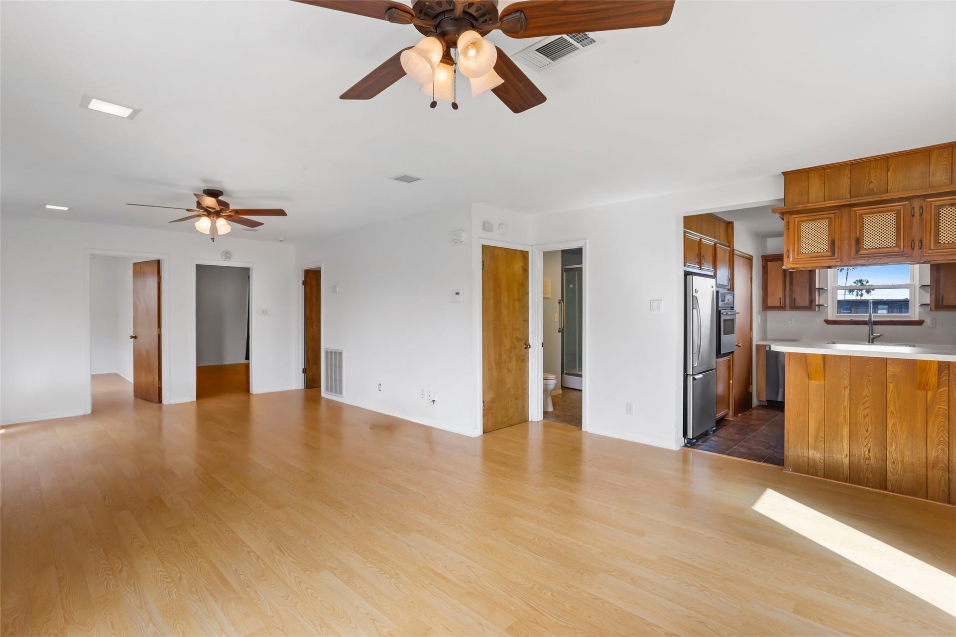31 Lakeside Drive, Hitchcock, TX 77563 All three bedrooms and a full bath are easily accessible from the main living area.