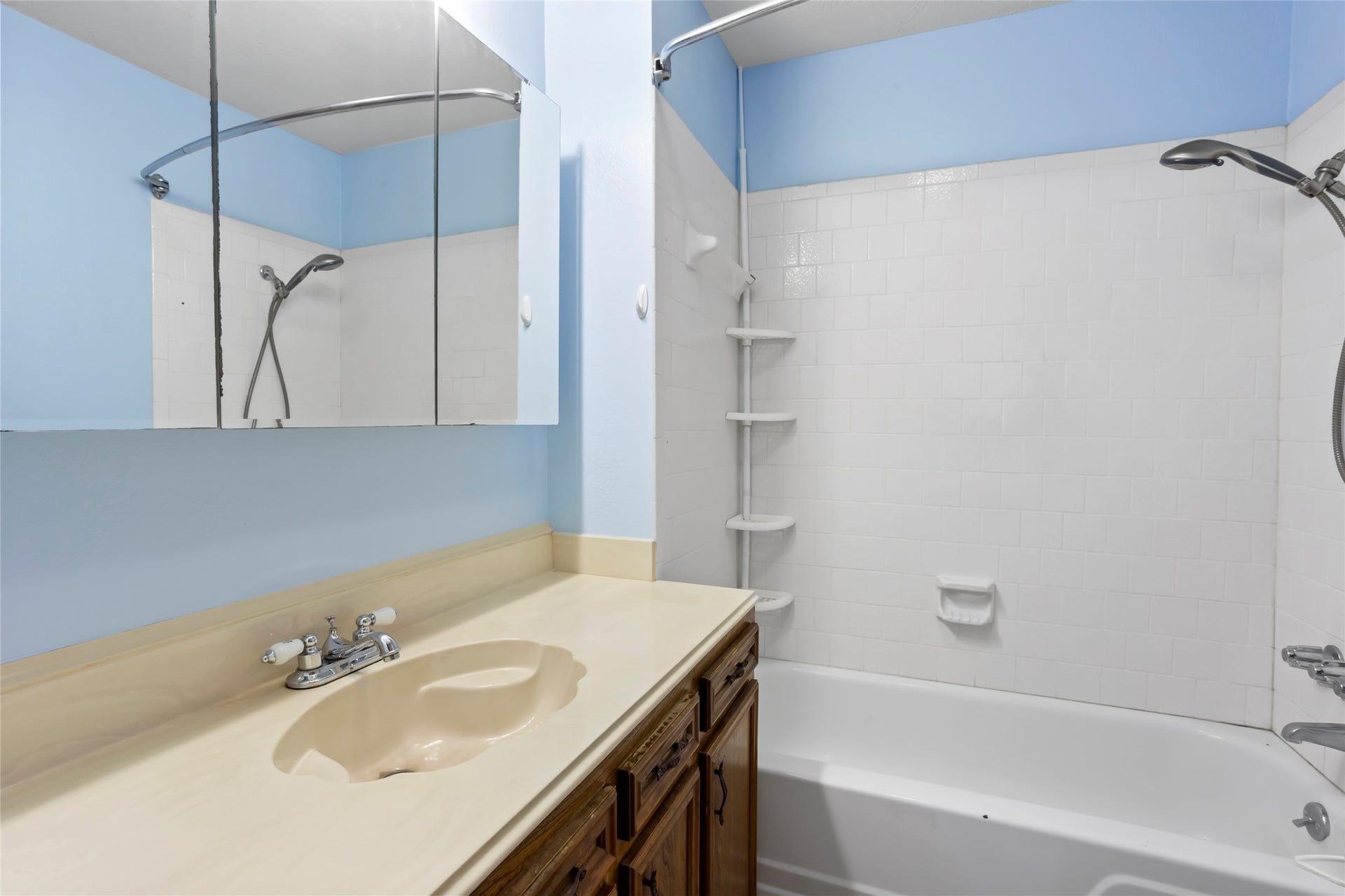 31 Lakeside Drive, Hitchcock, TX 77563 Elegant ensuite bathroom with a sleek vanity, ample storage, and a modern shower-tub combination for ultimate relaxation.