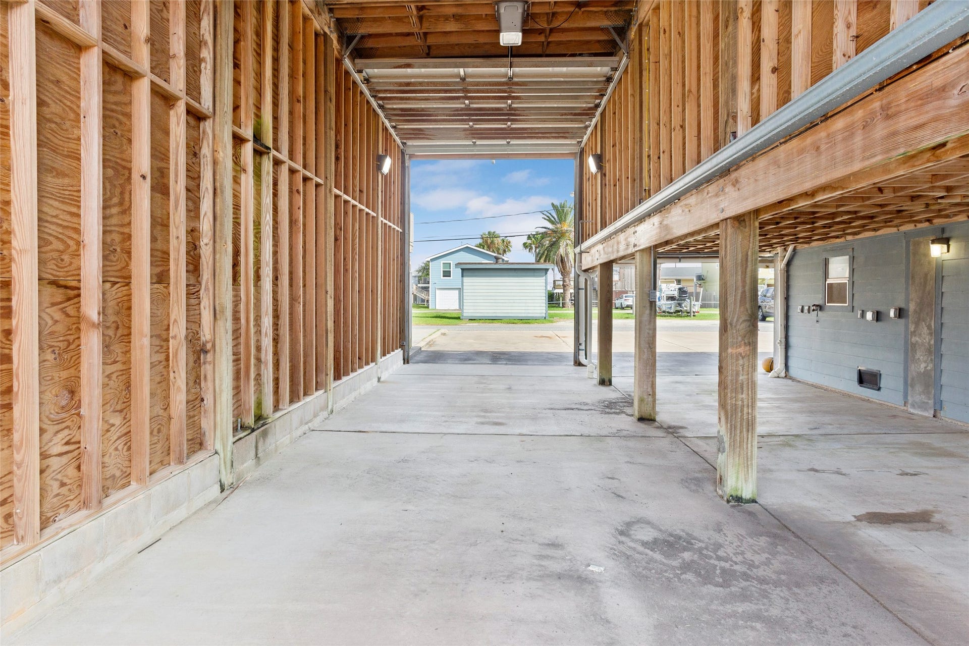 31 Lakeside Drive, Hitchcock, TX 77563 Spacious motorhome port with 12' x 44' x 16'TimberTech and wood decking, accessible via stairway.