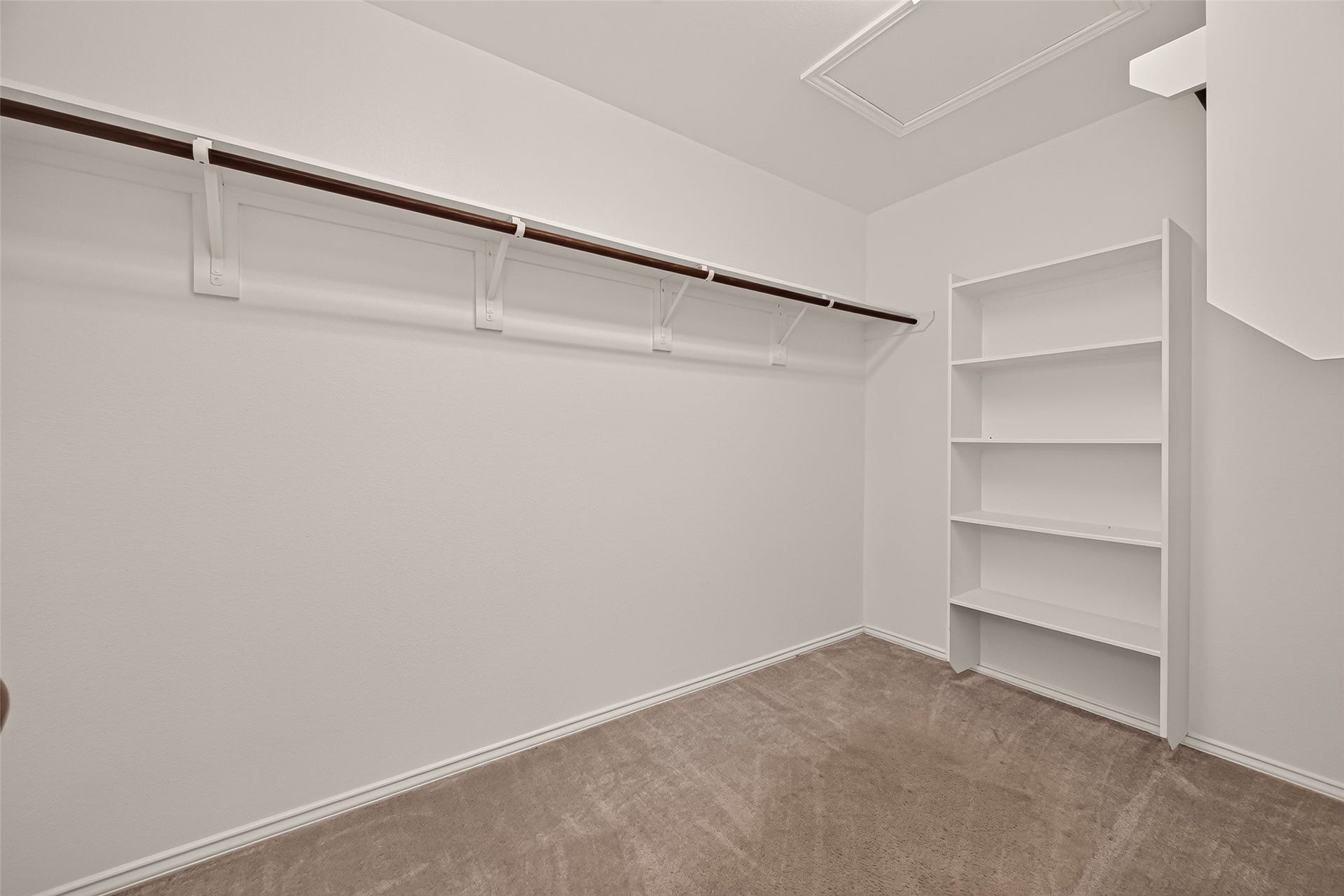 2011 Lost Timbers Drive, Conroe, TX 77304 Expansive walk-in closet featuring built-in shelving and ample storage space, thoughtfully designed to keep your wardrobe and everyday essentials organized and easily accessible.