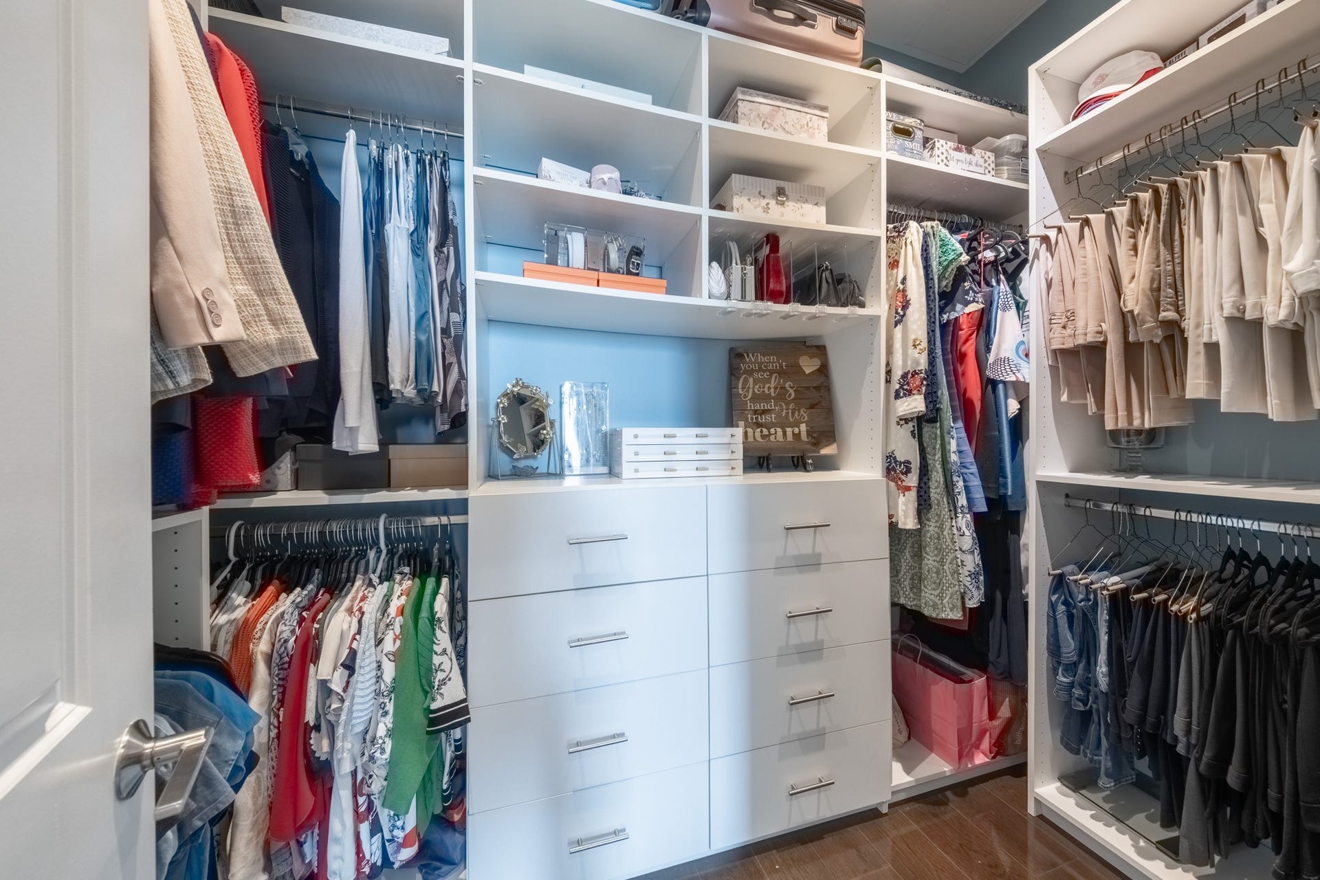 1211 Caroline Street, #1801, Houston, TX 77002 Another view of the spacious
primary walk-in closet
showcasing custom built-ins,
ample hanging space, and
organized shelving designed for
maximum functionality.