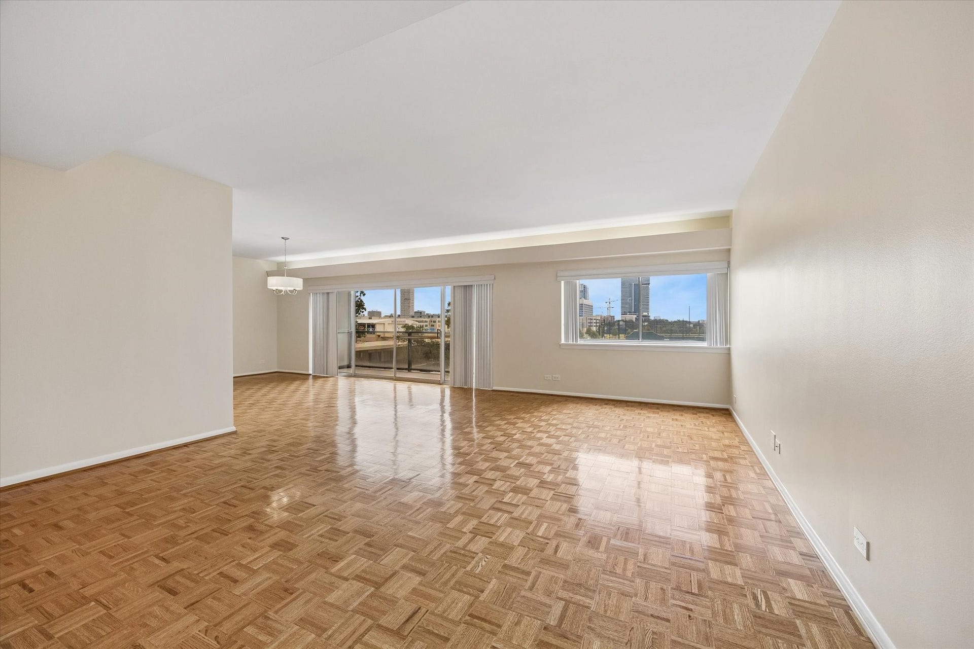 2929 Buffalo Speedway, #A303, Houston, TX 77098 Large Living Room (16.5 x 21.5) with plantation shutters and parkay flooring