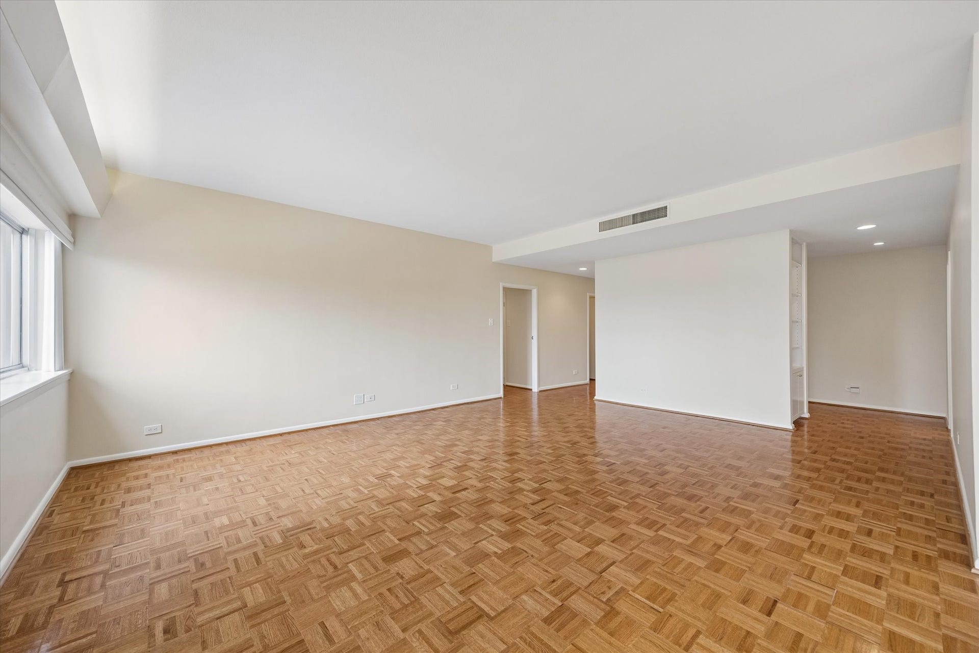 2929 Buffalo Speedway, #A303, Houston, TX 77098 Large Living Room (16.5 x 21.5) with plantation shutters and parkay floors