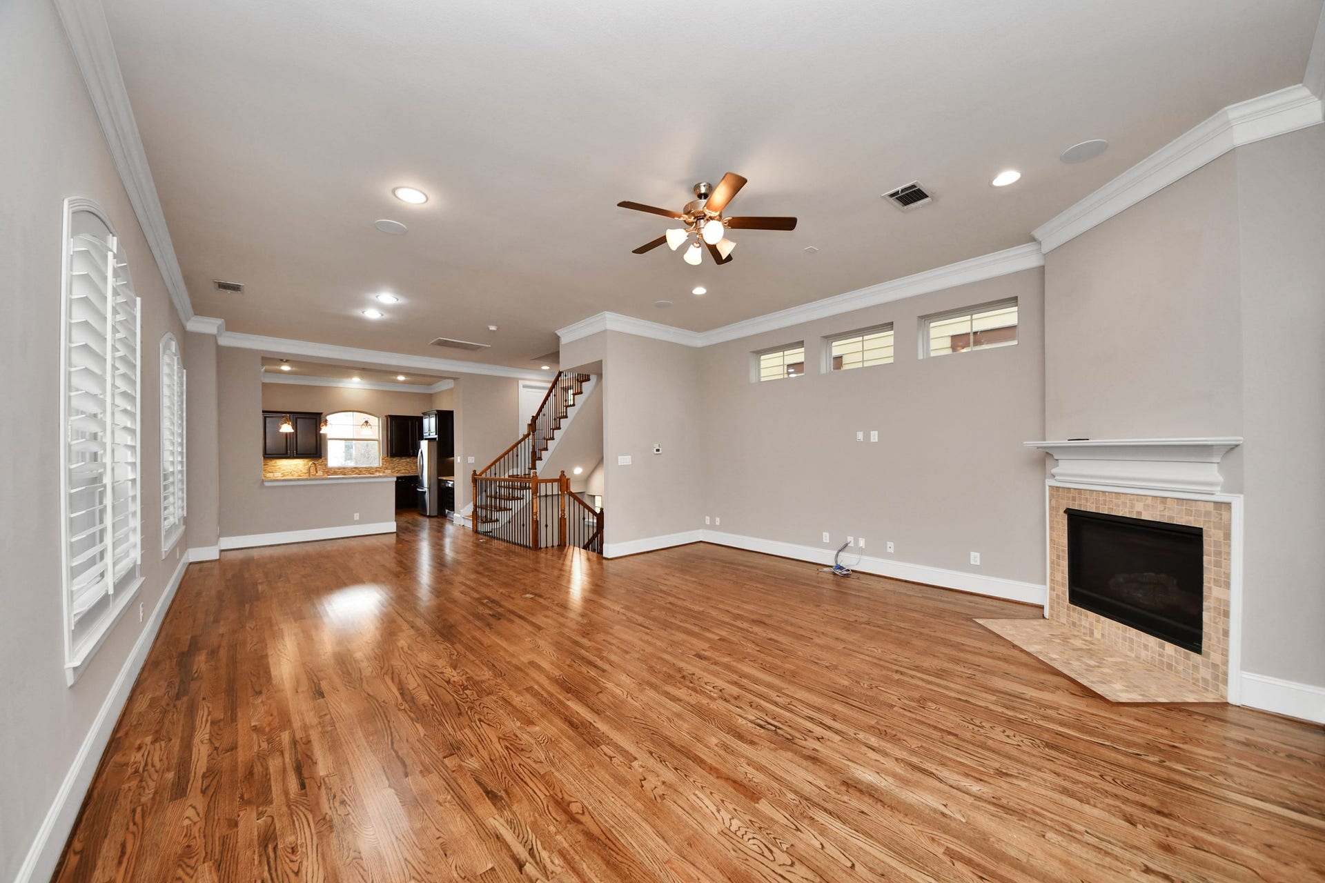1617 W 23rd Street, Houston, TX 77008 Another view of the spacious living room with hardwood floors, gas fire place, TONS of windows and a perfect area for your entertainment center!