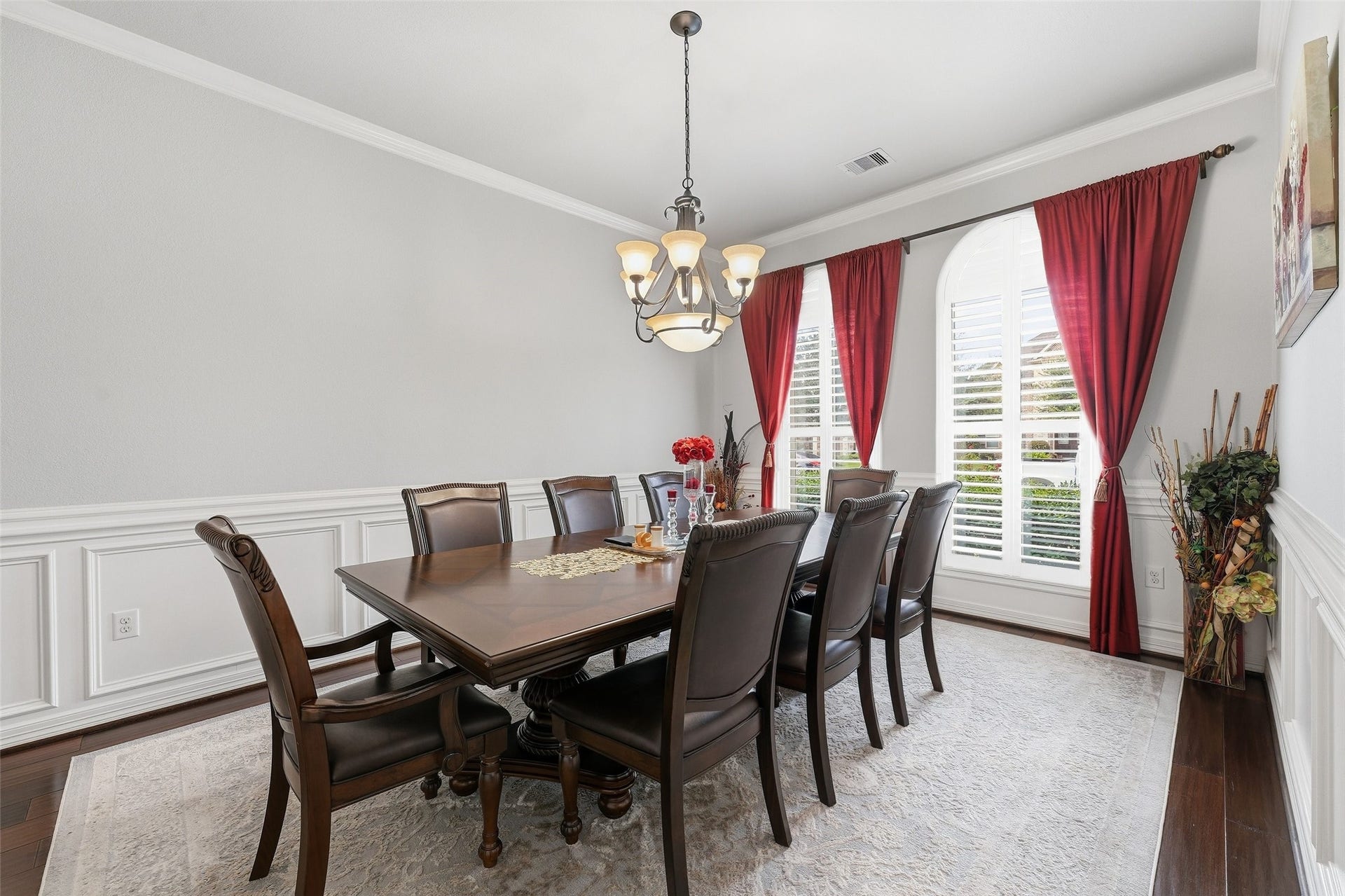 8311 Caroline Ridge Drive, Humble, TX 77396 Elegant wood accents, crown moulding, and large arched windows bring elegance to the formal dining room