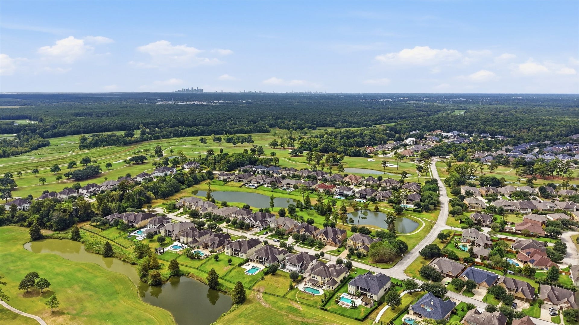 8311 Caroline Ridge Drive, Humble, TX 77396 Nestled in a serene, lush landscape, this picturesque neighborhood features elegant homes with spacious yards, surrounded by tranquil ponds and expansive green spaces, offering a perfect blend of luxury and nature.