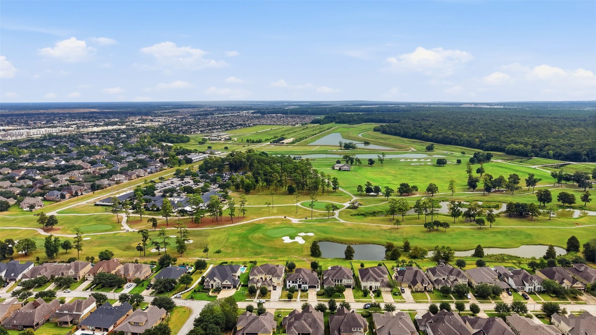 8311 Caroline Ridge Drive, Humble, TX 77396 Experience luxurious living with stunning golf course views, nestled in a serene neighborhood surrounded by lush greenery and tranquil landscapes.