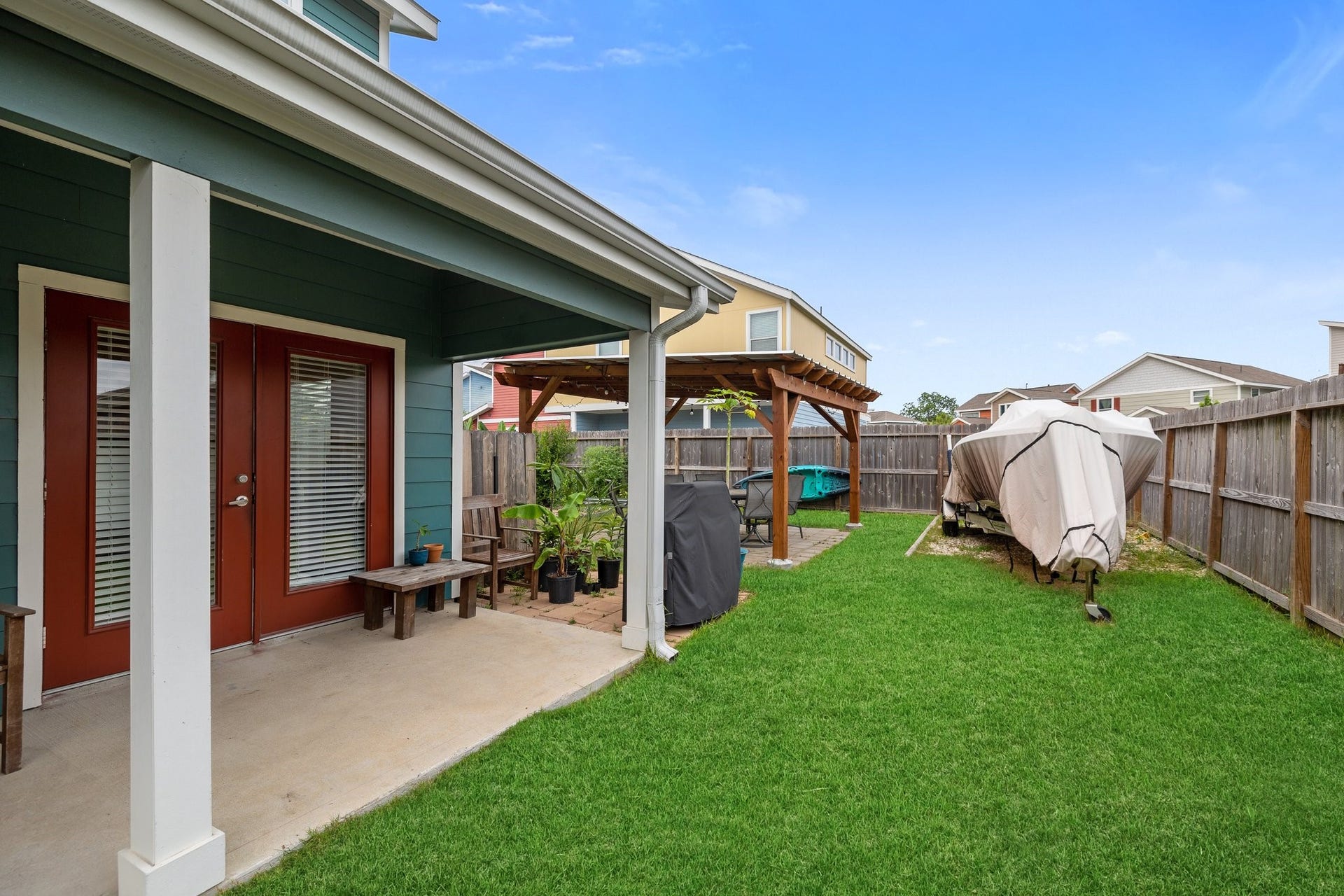 4206 Darter Street, Houston, TX 77009 Large green space with covered patio and pergola.