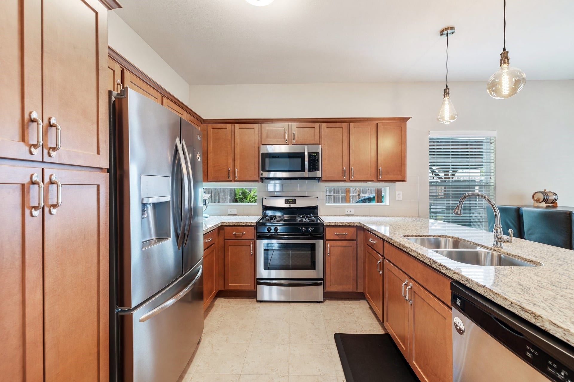 4206 Darter Street, Houston, TX 77009 Through the living room, you will find an incredible kitchen with granite countertops and stainless steel appliances.