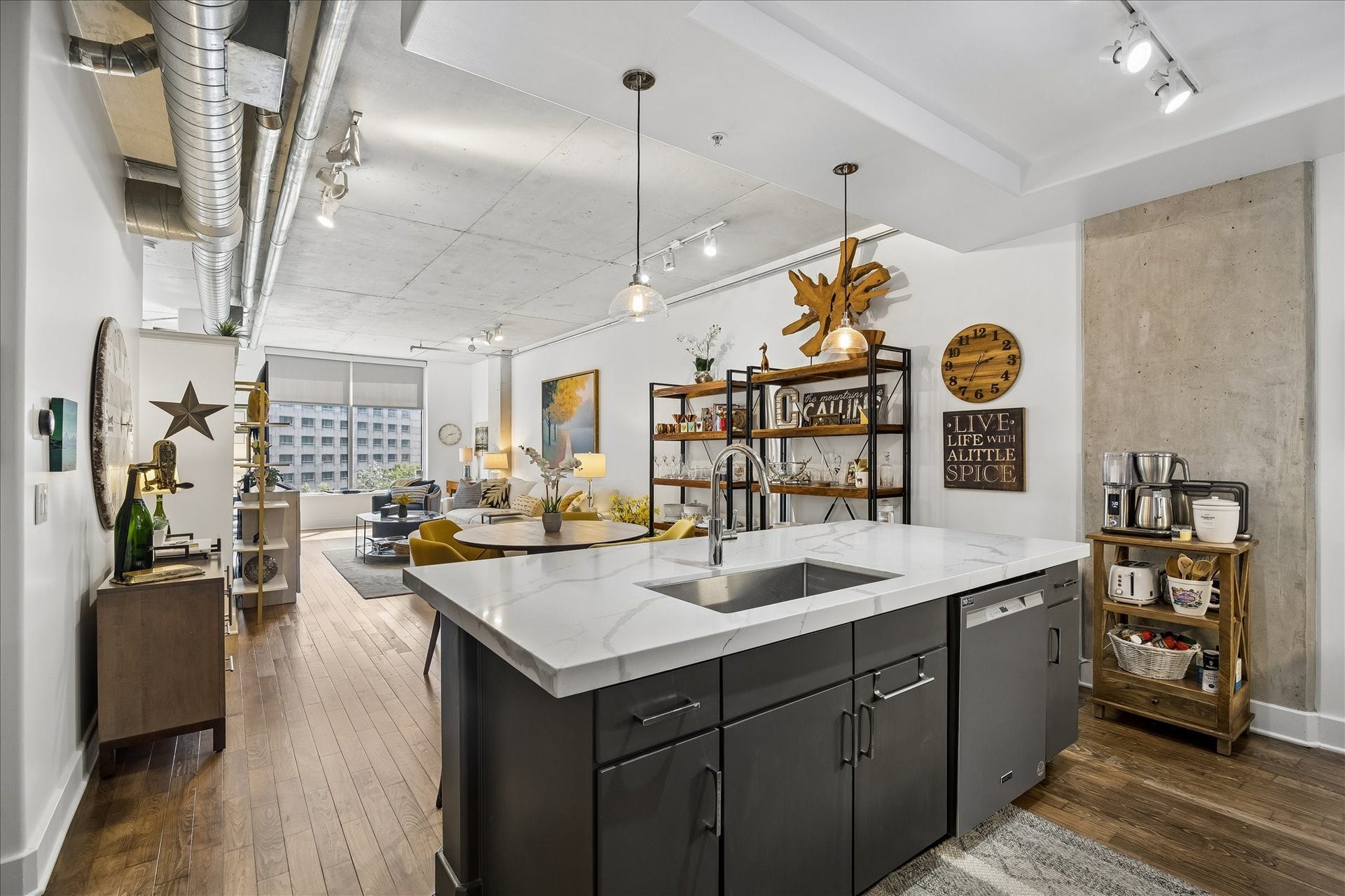 The wall shelves create form and function.  A spill over of kitchen items with a few decorative items in between adds interest, style and smart storage.