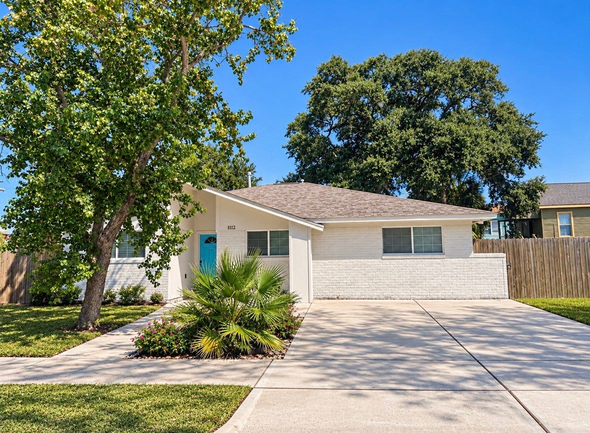 1112 32nd Street, Galveston, TX 77550 1112 32nd St Front Elevation. With a long Driveway.