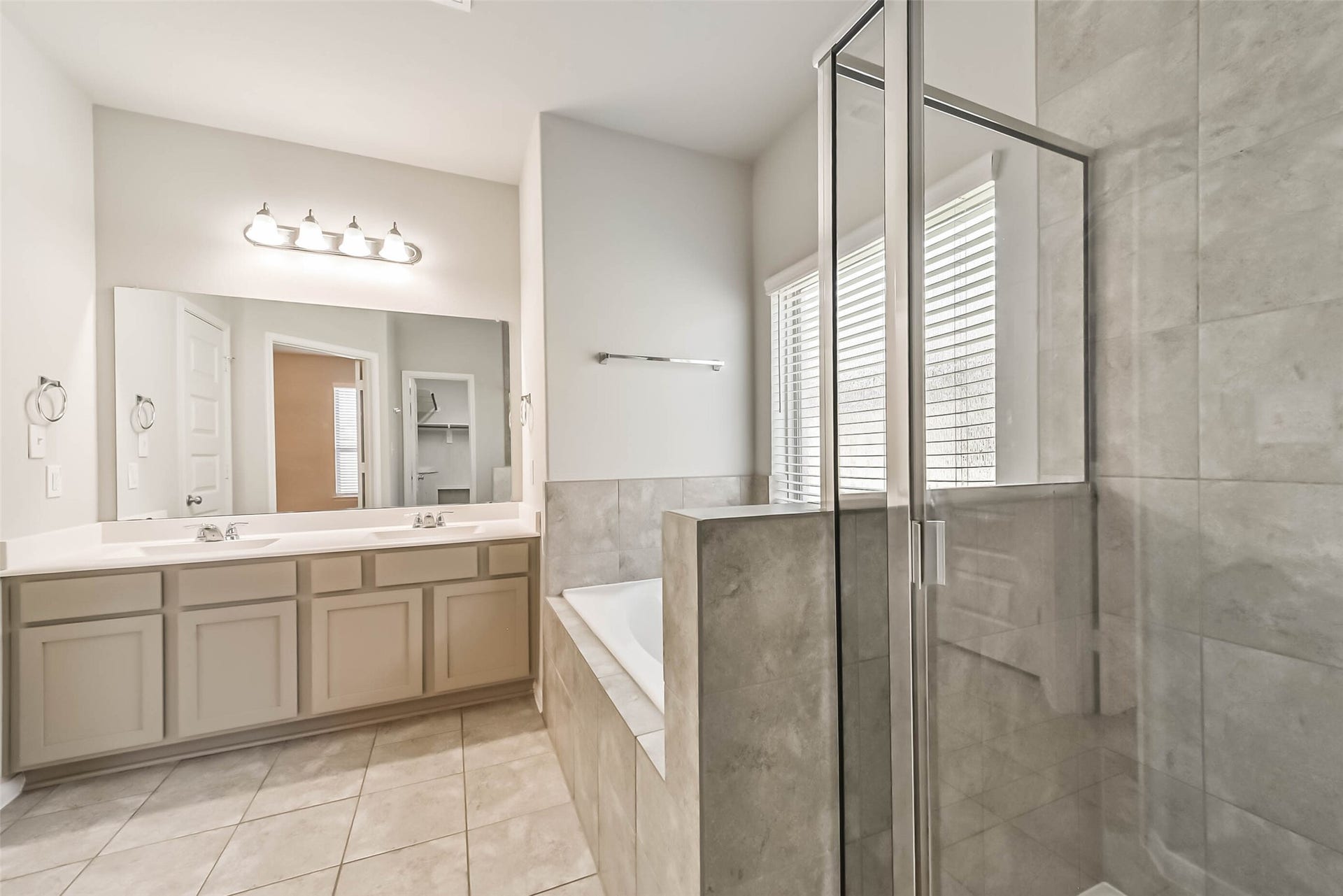 Dual vanities and generous primary bathroom storage.