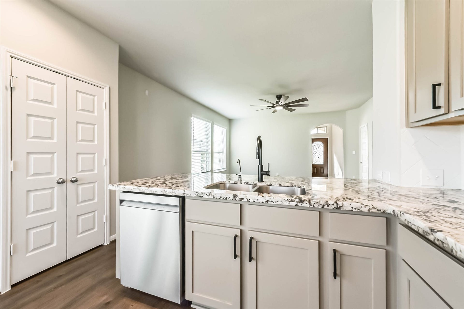 Upgraded sink faucet and stylish cabinet hardware.