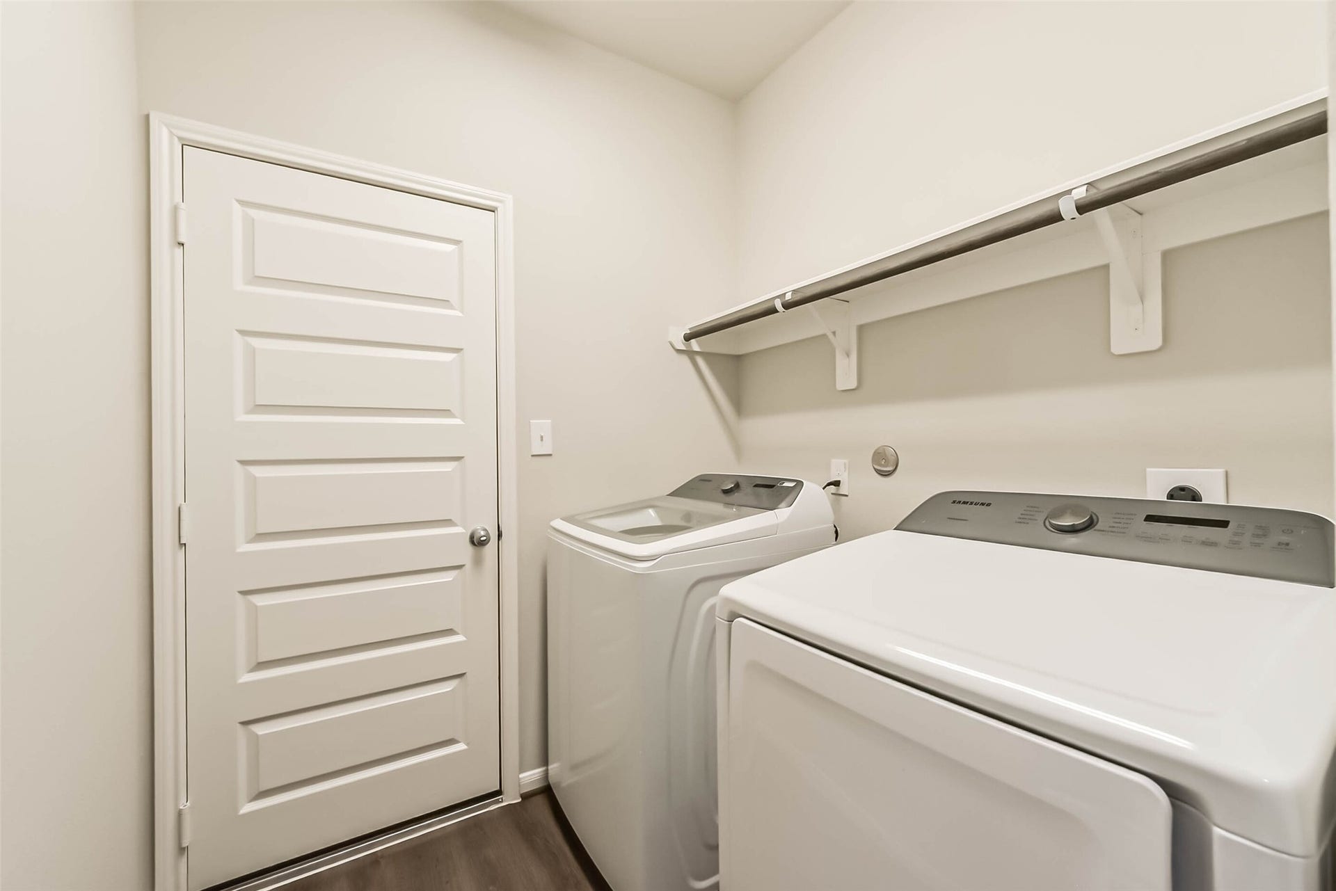 Functional laundry room with additional storage.