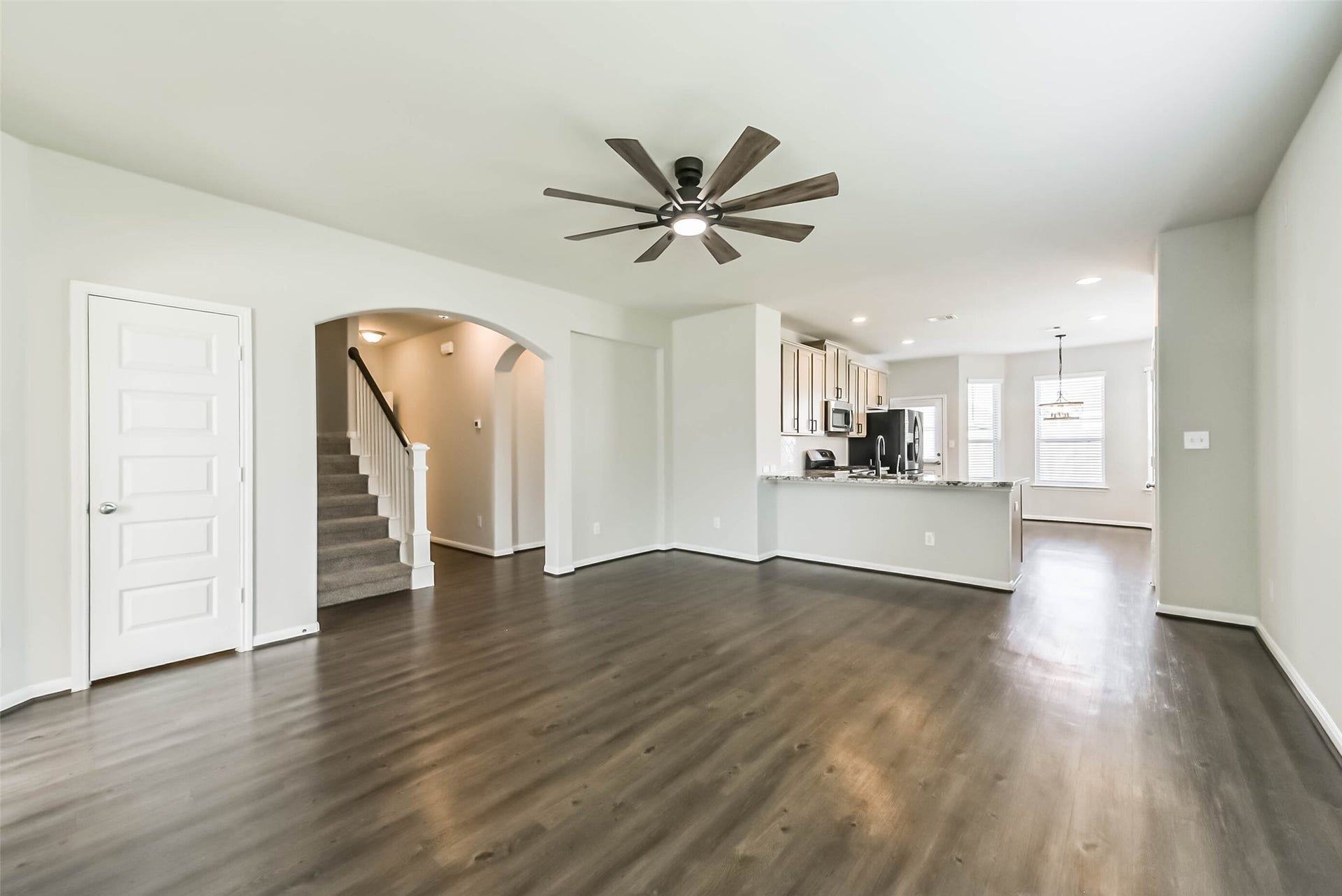 Open-concept living with beautiful upgraded flooring.