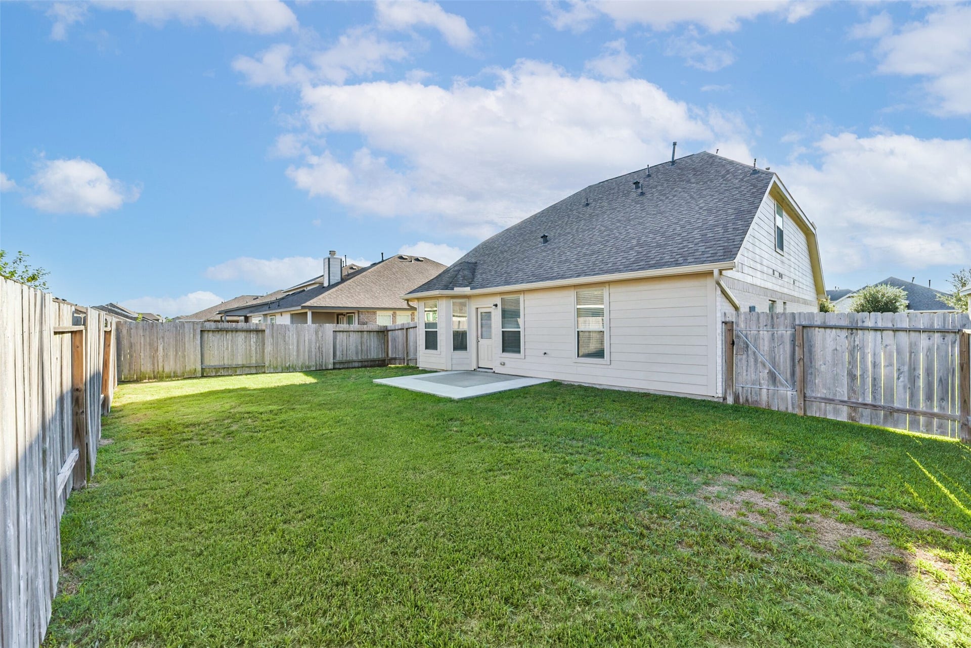 Spacious fenced backyard with room to enjoy outdoors.