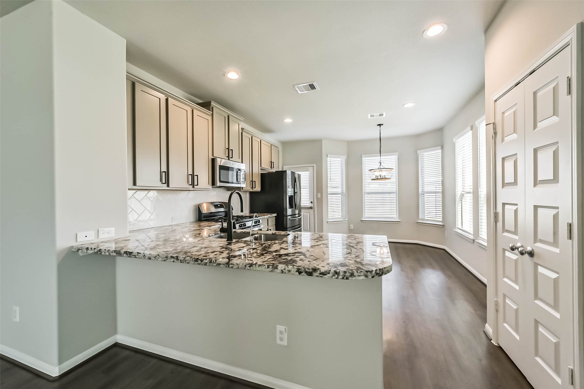 Beautiful kitchen opens to the main living area.