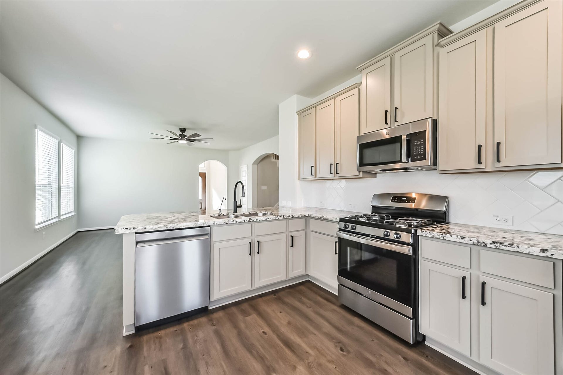 Kitchen features updated hardware and premium dishwasher.