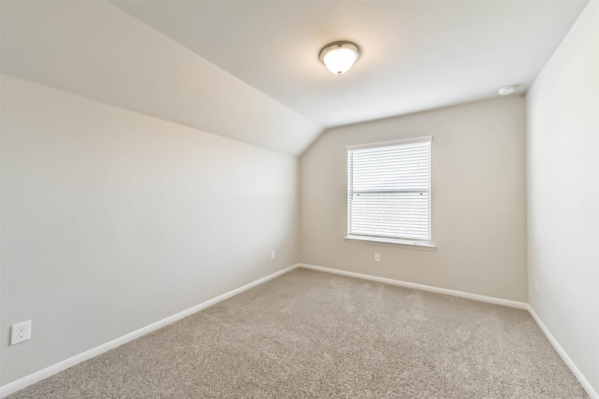 Comfortable secondary bedroom with ceiling fan.
