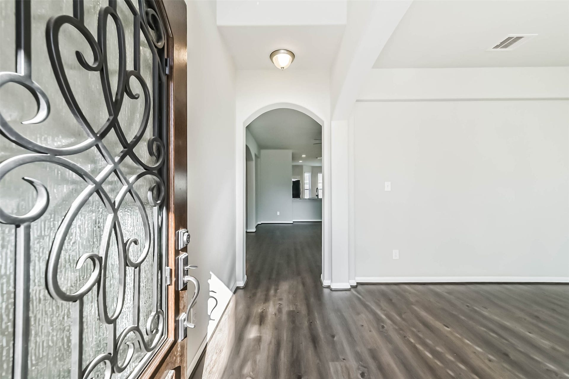 Welcoming foyer with soaring ceilings.