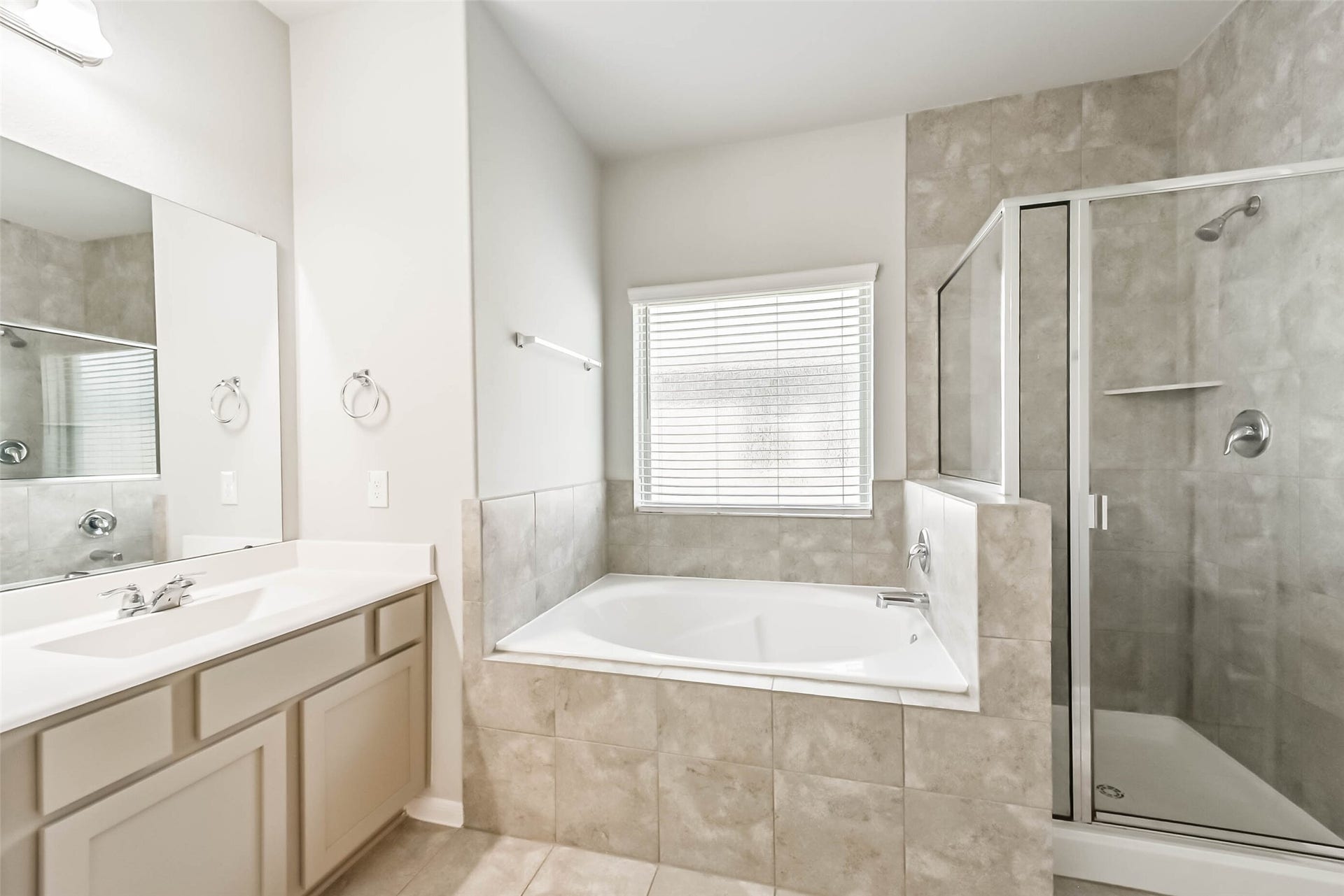 Relaxing primary bath with soaking tub and separate shower.