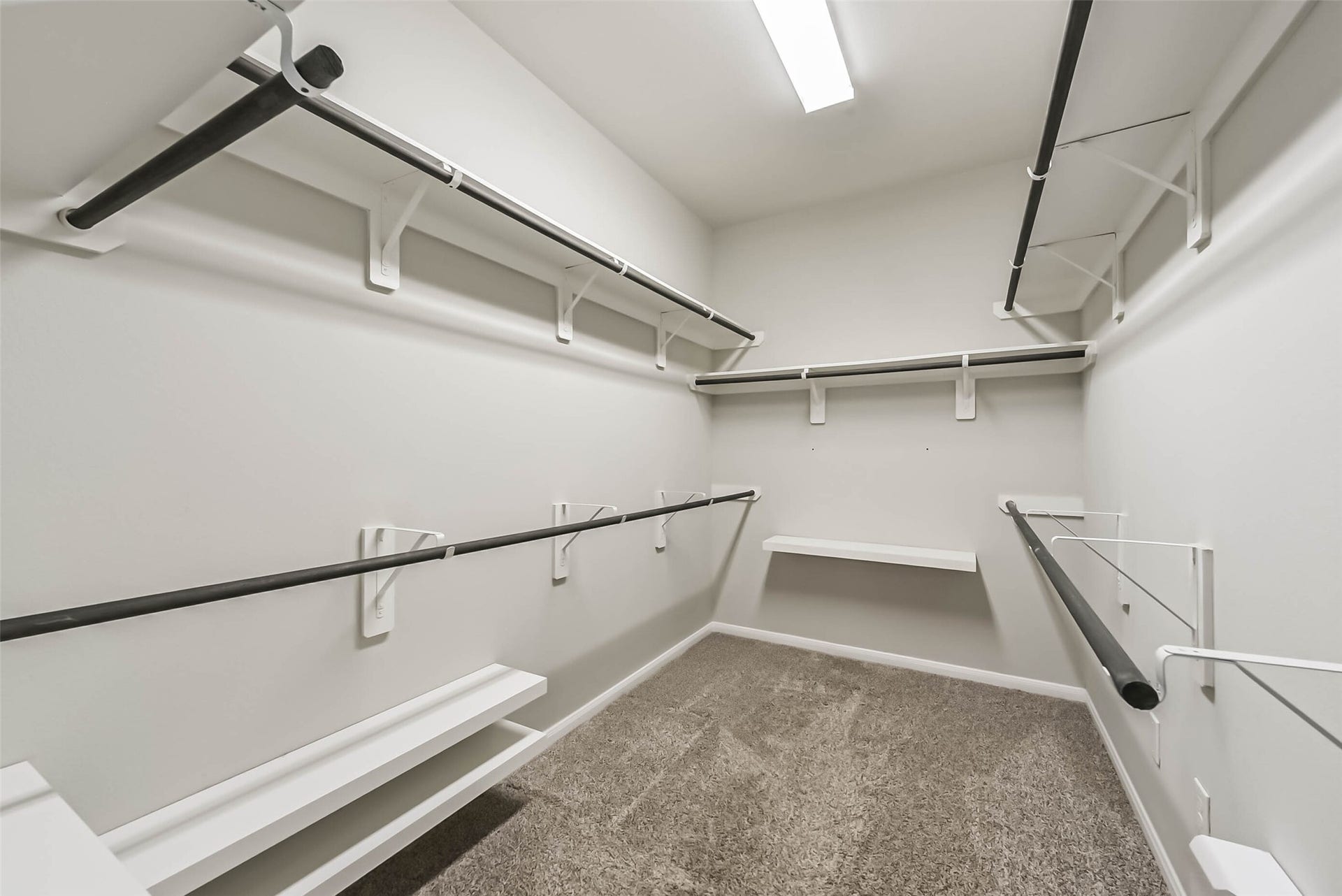 Custom closet shelving maximizes storage and organization.
