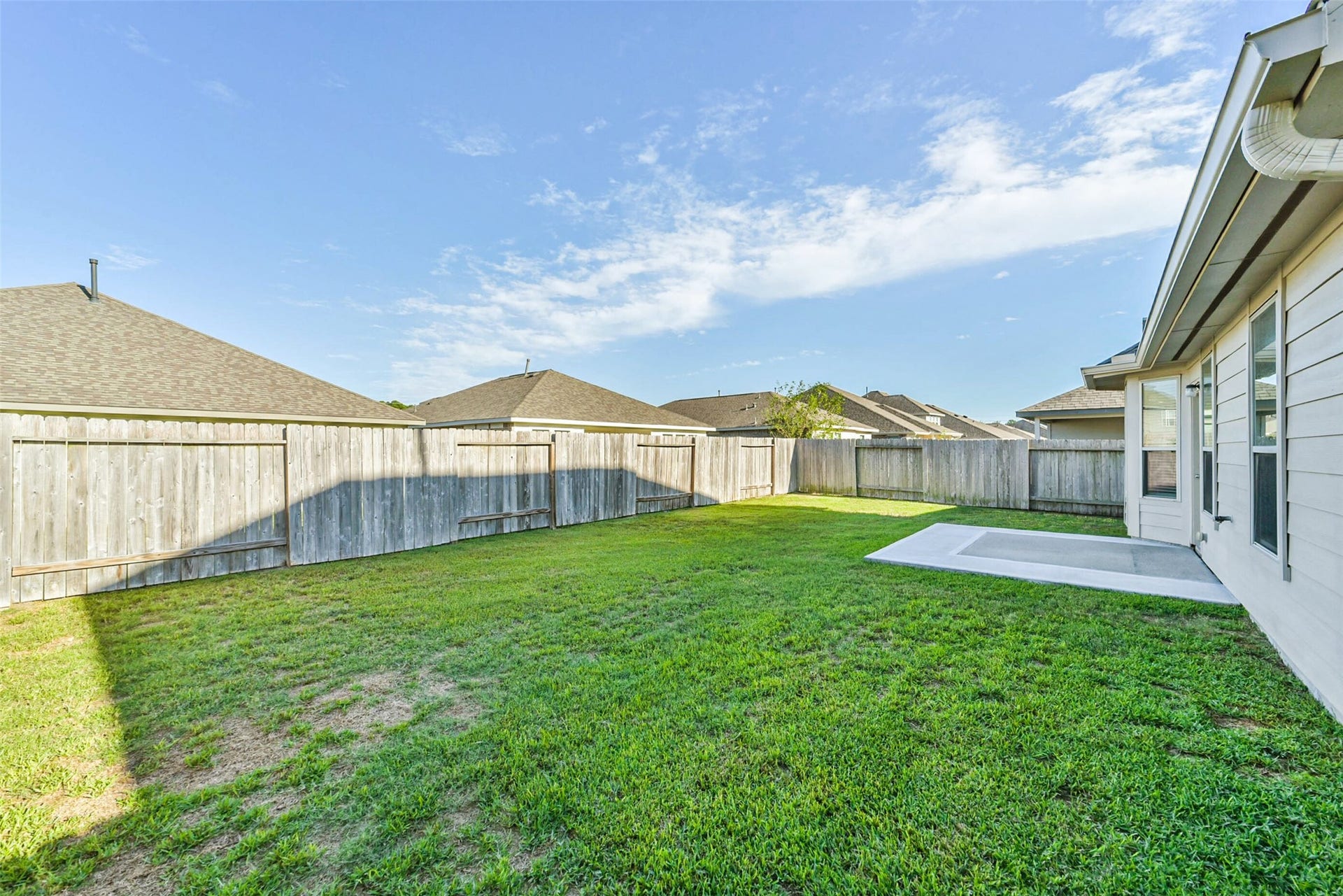 Extended backyard patio offers additional entertaining space.