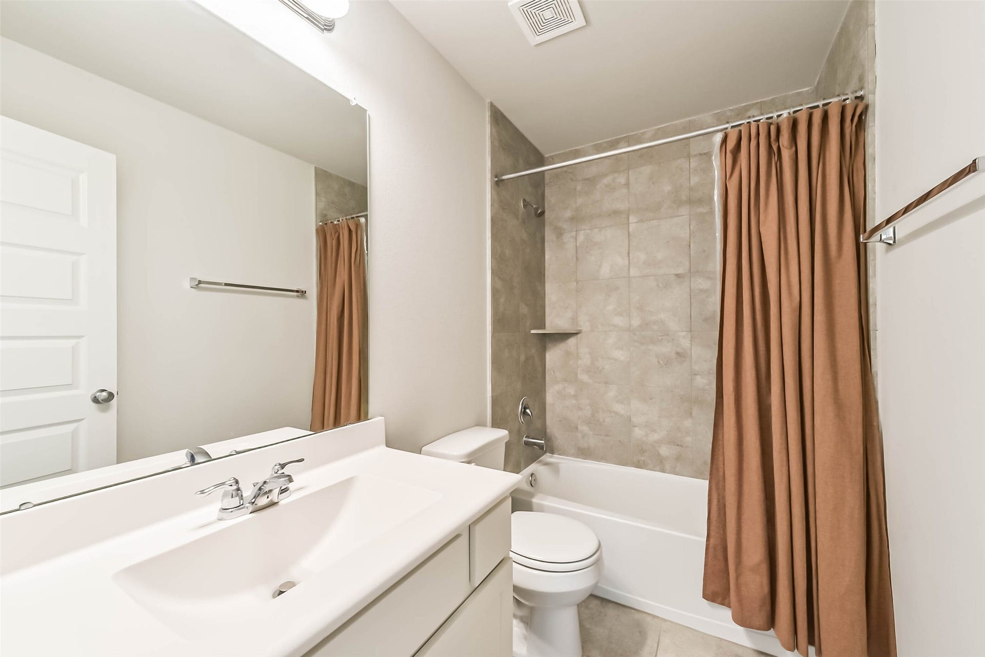 Upstairs bathroom with convenient vanity storage.
